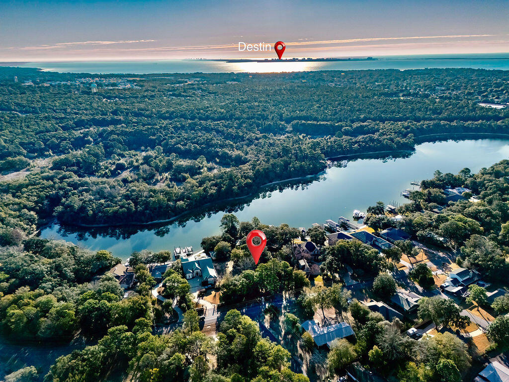 2 Adjoining Lots, 1.3 acres, 230 waterfront feet on a peninsula! For the first time in over half a century, this coveted, multi-generational property in Poquito Bayou is available to the public. This is not just a lot; it is a sanctuary. Spanning a massive .8 acres with over 145 feet of waterfront, this parcel sits on a rare, protected bluff. This elevation offers peace of mind few waterfront owners possess: No flood insurance is required.

While the rest of the world rushes by, life here moves at the pace of the tide. The deep waters of the bayou are legendary for their calm, protected nature--even during rough weather. You can kayak or paddleboard nearly 365 days a year, paddling out to watch dolphins corral fish for breakfast or spotting a manatee gliding through the glass-like surface. Your view? A pristine natural forest across the water--no neighbors looking back at you.Just you, the jumping mullet, and the bald eagles and ospreys hunting at sunrise. This is the rarest of opportunities to secure a high-and-dry, deep-water estate that has been held tight by one family for five decades. Don't let another decade slip by dreaming about it. (Individual Lot Sales-MLS: 994271 & 1002259)