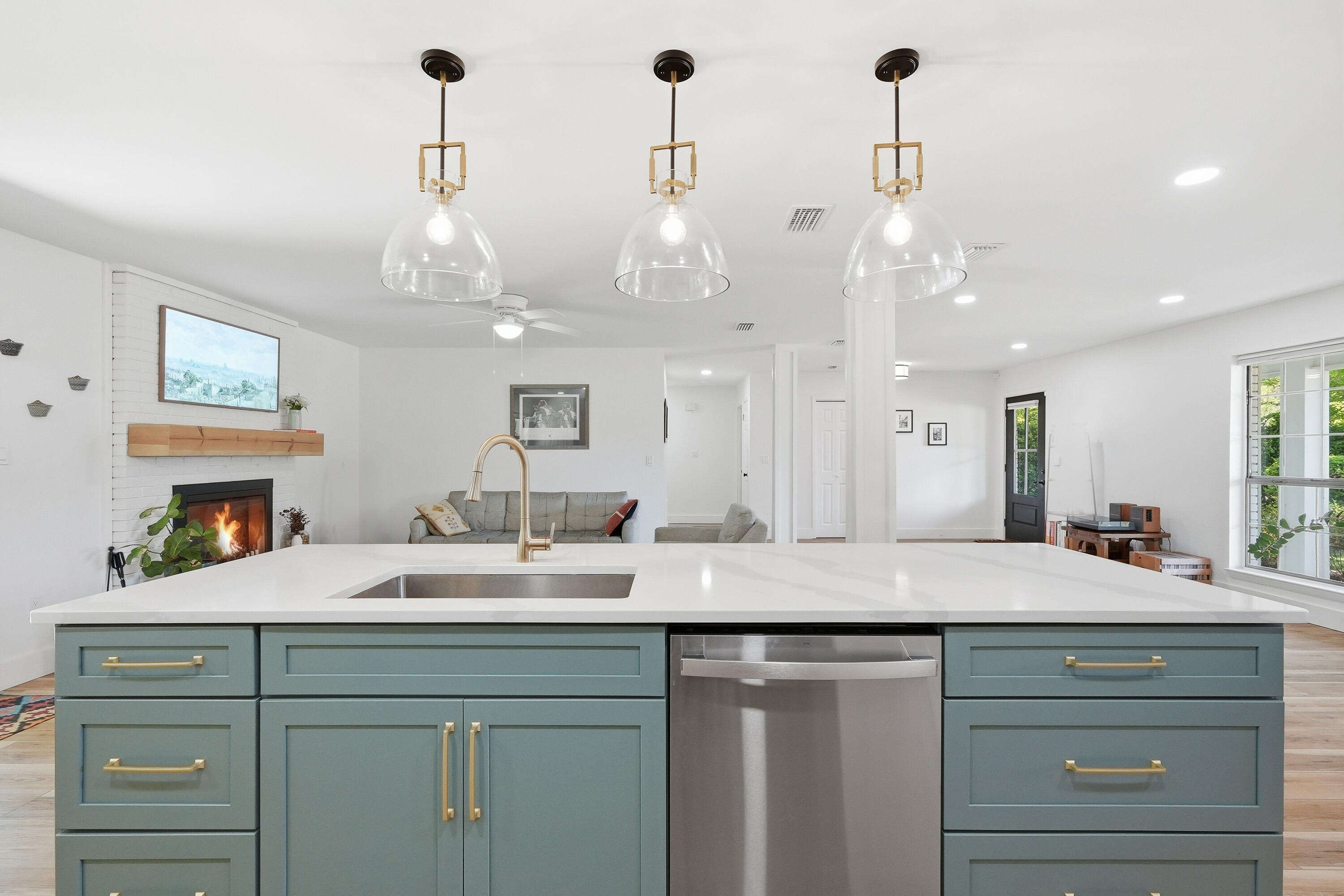 This beautiful ranch was recently remodeled in 2024 (w/ effective year built 2015)!  The sellers wish they could bring this home to their new location!  The friendly front porch and custom paver driveway welcome you as you pull up. Shutters and gutters are stylish and practical.  Step inside and you'll instantly feel at home! Stunning open-concept great room seamlessly blends the living, dining, and kitchen areas, creating a bright and inviting space perfect for both everyday living and entertaining. The expansive layout is highlighted by beautiful wide-plank flooring, abundant natural light, and a clean, modern aesthetic throughout. The kitchen features a large center island with seating, quartz countertops, stainless steel appliances, custom cabinetry, and designer pendant lighting MORE> The kitchen flows effortlessly into the spacious dining area and cozy living room, highlighted by a charming fireplace and views of the backyard.  Thoughtfully designed with both style and function in mind, this light-filled great room offers a perfect balance of warmth and sophistication, making it the true heart of the home.  The spacious and serene primary suite offers a peaceful retreat feel and even accommodates a sitting area.  Enjoy a spa-inspired ensuite with dual vanities, quartz countertops, designer lighting, and a sleek walk-in shower with tile, glass enclosure and rainfall head. The oversized walk-in closet provides ample storage and organization.  Custom cellular shades throughout the home are an upgraded bonus!  Step outside to your backyard oasis.  You'll find plenty of room for play, pets, gardening and more. A large patio creates the perfect setting for outdoor dining and entertaining, with seamless access to the home. Fully fenced, lovely landscaping, and a new lawn pump help this backyard combine comfort, functionality, and natural charm. Your TIME is valuable - and you'll appreciate being SO CLOSE to Eglin AFB, parks, Shalimar Pointe Golf, swimming, boating, fishing.....Combs Park Playground, Meigs Beach Park and Two Georges Marina.  Come enjoy the laid-back Florida lifestyle at 12 Pinehurst Drive, Shalimar FL.
