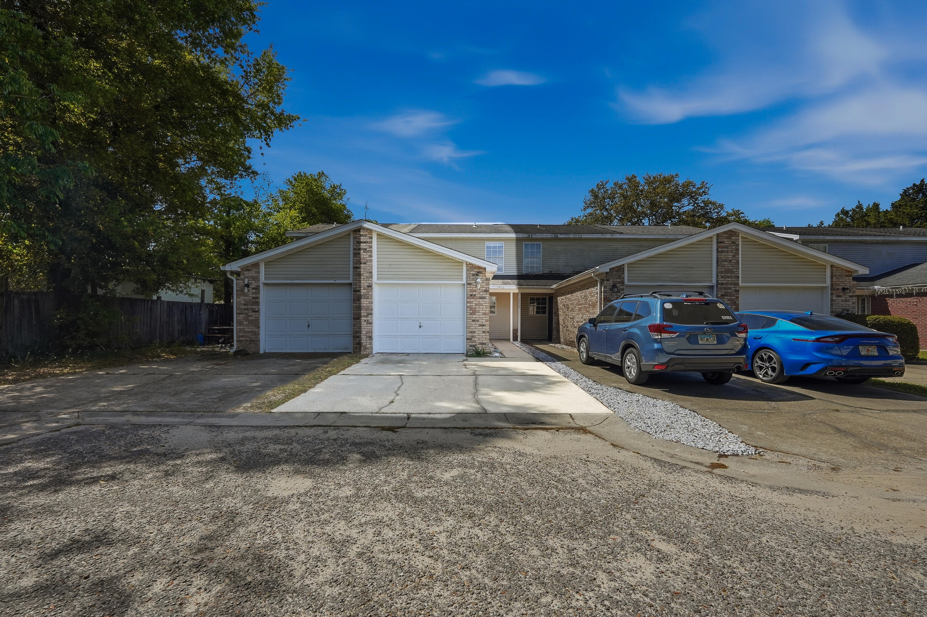 **3.2% Assumable Rate available for VA-Eligible Buyers! This updated two-story townhome in Fort Walton Beach checks every box for a smooth PCS landing. It's in move-in ready condition, there's no HOA, and it's an easy commute to Eglin AFB and Hurlburt Field. With a fully privacy-fenced backyard, attached garage, and a kitchen that's been almost completely rebuilt, this is the kind of home that takes the stress out of relocation.
Step inside to find neutral paint and beautiful tile floors throughout the entire home that's clean, low-maintenance, and ready for whatever a military move throws at you. The u-shaped kitchen just off the front entrance has many updates with stainless steel appliances, including a bottom-freezer refrigerator, new sink, and granite countertops. A pantry adds extra storage, and the kitchen opens seamlessly into the combined dining and living area keeping guests and family connected.
A dedicated laundry room and convenient half bath round out the first floor. Head upstairs to find both bedrooms and the full bath. The spacious primary bedroom features a walk-in closet and a private door directly to the full bathroom which includes a tub/shower combo and single vanity. There's also a secondary hallway entrance for guests. The second bedroom is well-sized with a ceiling fan, and both rooms stay comfortable year-round with central electric heat and air.
Out back, a fully privacy-fenced yard gives you a secure outdoor space for pets, grilling, or just unwinding after a long day. The covered patio extends your living space outside. The attached garage fits one vehicle and the driveway accommodates two more, so parking is never an issue.
Tucked at the end of a low-traffic dead-end street in the Winterhaven subdivision, this townhome keeps your commute short while putting beaches, dining, and shopping within easy reach. No HOA means no extra fees eating into your BAH. Schedule your showing today to see this move-in ready townhome!