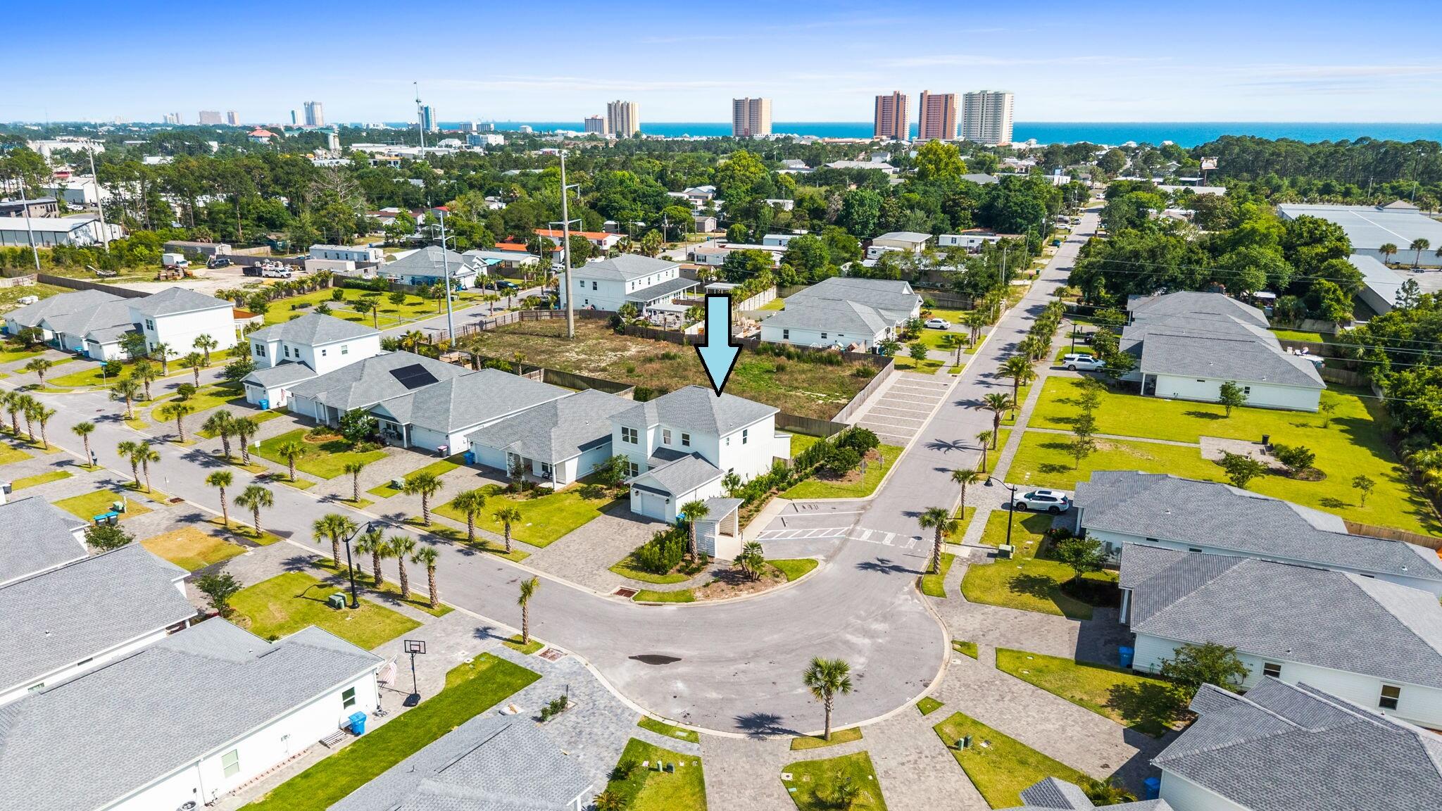 Welcome to Laguna Haven, a gated community located on the quiet and scenic West End of Panama City Beach near 30A and away from the heavy traffic and congestion. This beautifully designed Del Sol floor plan offers 4 bedrooms, 3 full baths, soaring 9-10 ft ceilings, porcelain tile flooring, crown molding, bull-nose corners, and designer lighting throughout. Exterior features include durable Hardie board siding, a paved driveway, lush landscaping, a fully fenced backyard, and an above-ground hot tub for added privacy and relaxation. Offered with furnishings negotiable, with a stylish Miami-inspired design, this home is turnkey and ready for short-term rental or personal use. Short-term rentals are allowed, and similar floor plans in the community have produced over $90,000+ in annual rental revenue. The HOA maintains the gated entrances, sidewalks, community lighting, landscaped green spaces, and covered mailbox area, making this an ideal investment, second home, or full-time residence.