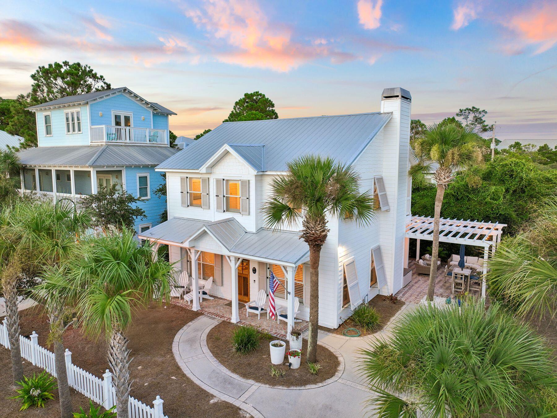 Set on a quiet cul-de-sac in the Gulf Mist community of Seagrove Beach, 46 Crystal Court offers deeded beach access directly across Scenic Highway 30A, with two additional public beach accesses just moments away. This intimate, low-density neighborhood offers a private community pool and the rare kind of quiet that comes with only a handful of homes sharing the street.
Guests enter off the front porch into an updated kitchen finished with granite countertops, a tile backsplash, stainless steel appliances, and a separate island. Tile flooring runs throughout the main level, where the open living and dining areas are anchored by a fireplace and finished with updated lighting and ceiling fans. This level opens onto a back deck and a large brick patio, complete with a separate storage building, table seating, and a shaded seating area under a pergola with room for a crowd. A laundry room, full bathroom with tub and shower, and a bedroom with twin beds round out the first floor. The driveway is framed by mature, well-kept landscaping. Upstairs, a king bedroom with a private ensuite and a full bathroom opens onto its own porch overlooking the pergola below. The primary suite offers an oversized layout with a walk-in closet and a fireplace, along with a spacious bathroom featuring a garden tub, a separate stand-up shower, and a double vanity. The primary suite opens onto a private deck of its own.
A new roof was installed in 2025. Offered fully furnished with an established, strong rental history, 46 Crystal Court is a turnkey opportunity for a primary residence, second home, or investment property in one of 30A's most sought-after settings.