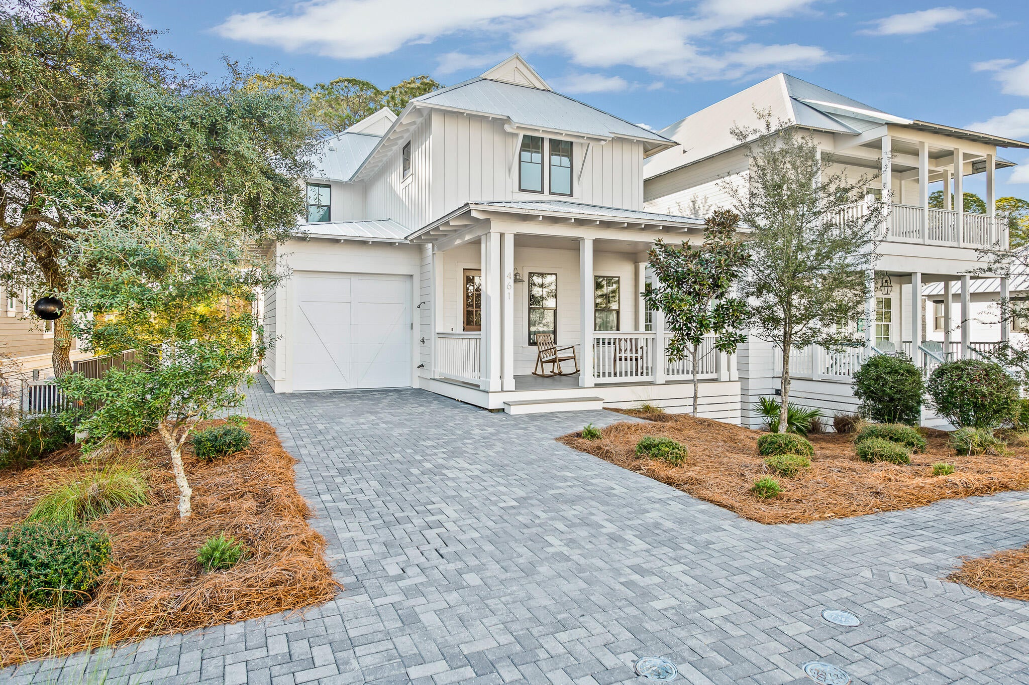 Discover this stunning custom built home at 461 Matt's Way, located in the gated community of Lakeside at Blue Mountain Beach. Designed by Archiscapes & offering views of the preservation area around Redfish Lake, this thoughtfully crafted residence is an exceptional blend of privacy, comfort, & proximity to the Gulf. Complete with 4 spacious bedrooms, an office, 3 full bathrooms each with double vanities plus a powder room, this house is perfect for families & investors alike. Enjoy details such as a master suite on the 1st & 2nd floor, walk-in closets, custom trim work & walnut wood floors throughout. At the heart of the home, a bright, open-concept kitchen with a large island creates an inviting setting for entertaining & everyday living. Relax on the enlarged front porch or one of two rear screened porches, take a swim in the neighborhood pool or stroll a half mile to the Gulf. Quality construction includes impact windows, a metal roof, hardie board siding, & a one-car garage with epoxy-coated flooring. Ample storage is available in the attic and on the concrete slab beneath the house. This property is a short walk from shopping, dining & activities in Redfish Village & Blue Mountain Beach. In addition, the home has easy access to the Longleaf Pine Trail leading through the Point Washington State Forest. Whether envisioned as a primary residence, coastal retreat, or investment property, 461 Matts Way captures the relaxed charm of life in Blue Mountain Beach.