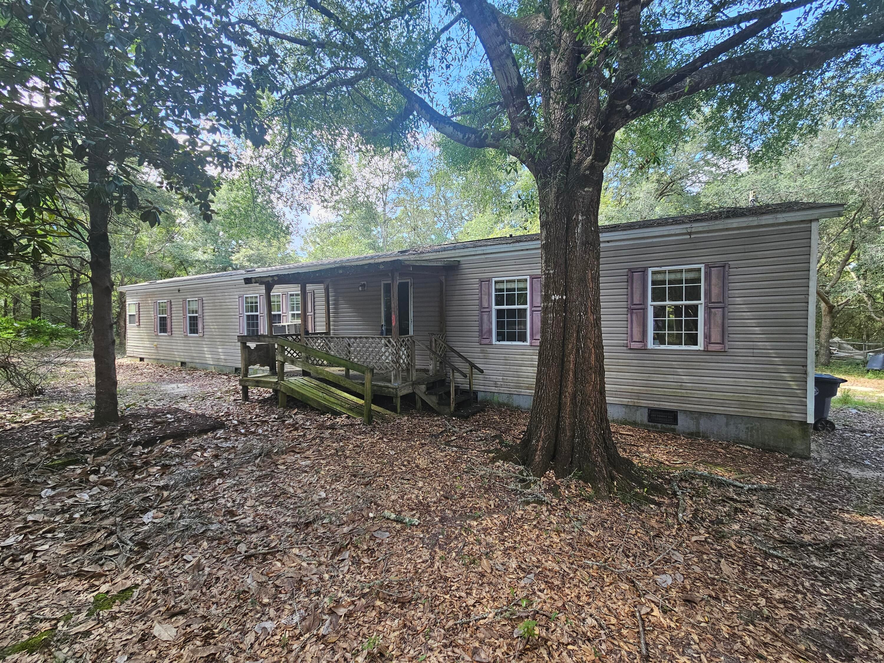 Investor and cash-buyer opportunity in the Pipers Landing area near King Lake and Lake Holley. This 2007 manufactured home sits on a full acre with mature oaks and sits back off the road for privacy. 2 bedrooms, 2 baths, 1,107 square feet, with an open kitchen/living layout, primary suite with a garden tub, and a covered front porch.

Home is being sold strictly AS IS. Cash or conventional financing only. Priced with rental income and long-term hold potential in mind -- a straightforward acquisition for an investor's portfolio or a buyer comfortable putting in their own work. Full acre lots in this location don't come up often. Schedule your showing today.