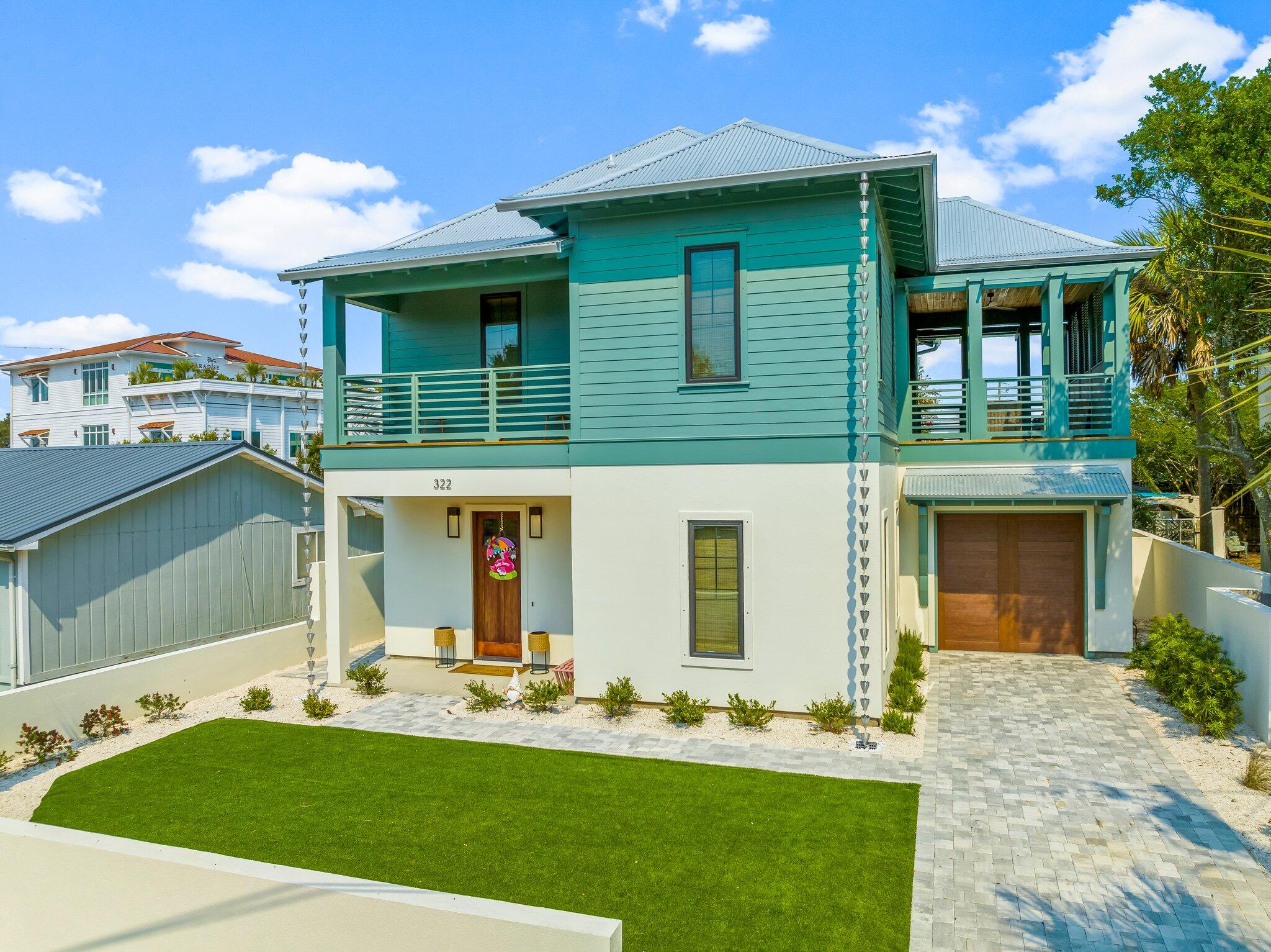 Welcome to your turnkey coastal haven at 322 Sea Breeze Drive, a stunning Rosemary Beach-inspired retreat nestled in the rapidly emerging west end of Panama City Beach, just moments from beach access. Whether you're seeking a premier short-term rental investment or your ultimate dream vacation escape, this property delivers on every level. Currently enrolled in a rental program with $47k already on the books and projected to generate nearly $80k this year, the income potential here is truly impressive.
Step outside into your own private oasis, where an oversized veranda, fully equipped outdoor kitchen, and resort-style saltwater pool with waterfall feature and sun ledge create the ultimate setting for entertaining and unwinding. A whole-home generator ensures true peace of mind year-round.
Inside, the designer finishes are nothing short of extraordinary. The light-filled living room showcases a dramatic coffered ceiling and sleek linear electric fireplace, while the chef's kitchen dazzles with quartz countertops, custom cabinetry, an apron sink, a striking accent island, designer lighting, and a bold statement backsplash. A floating staircase with cable railings adds breathtaking architectural flair from the moment you arrive. The thoughtfully designed split floor plan offers two primary suites, one on the main level and one upstairs, providing privacy and comfort for every guest. The upper level also features a welcoming loft, a fun bunk bedroom with full-size bunks, and an additional guest room with a queen bed, all sharing a convenient Jack-and-Jill bath. Just off the loft, a charming shaded porch with shutters offers the perfect nook to curl up with a book or decompress after a sun-filled day at the beach.
Modern craftsmanship, coastal allure, and effortless luxury, all in one address.