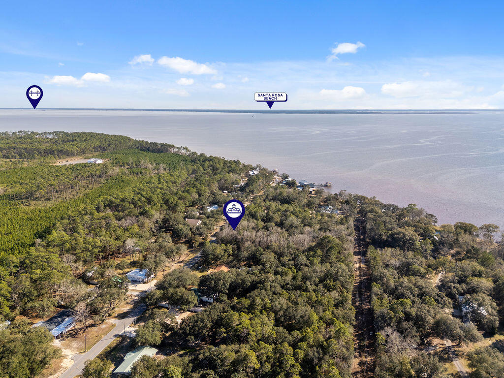 Discover the perfect spot to build your dream home! This level, nearly half-acre lot is nestled between Freeport and Niceville, offering both convenience and a peaceful setting. Enjoy the beautiful view of the bay, and the coastal breeze as you drive down Marsh Dr. to your new home.  No homeowners association (HOA) restrictions, offering a blank palette . Whether you're looking to create a private retreat or an investment property, this location provides an excellent opportunity.
Don't miss this chance to own a piece of the Florida Gulf Coast!