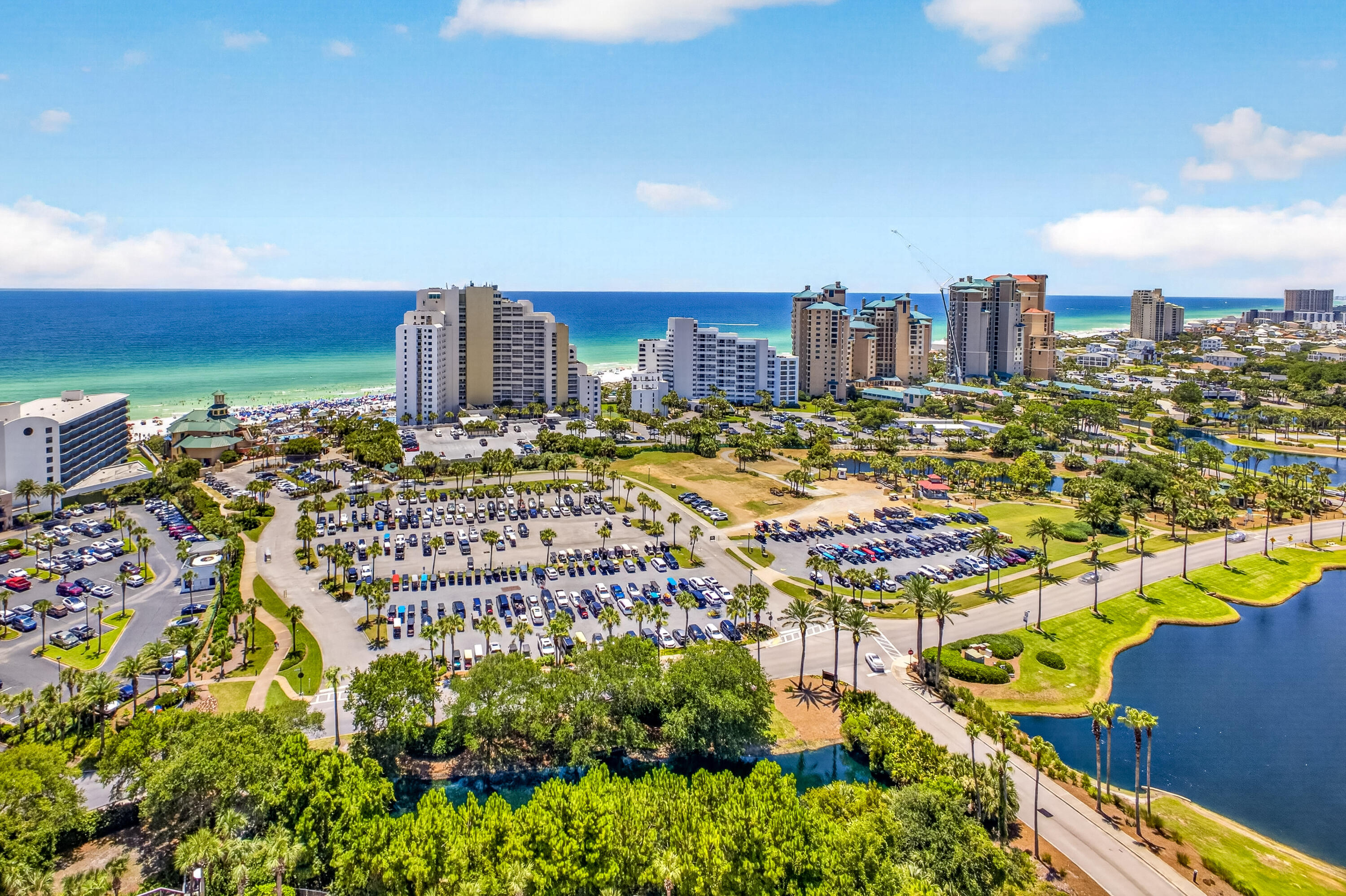 Perched on the 19th-floor penthouse level, this exceptional Luau residence showcases breathtaking panoramic views of the sparkling Gulf of Mexico, the tranquil lake, the Choctawhatchee Bay and the resort-style pool. From vibrant sunrises to unforgettable southwest sunsets, every day is framed by spectacular scenery from the expansive private balcony--an inviting outdoor retreat perfect for morning coffee, afternoon relaxation, or evening cocktails overlooking the water. Thoughtfully designed for both comfort and versatility, the residence offers a spacious two-bedroom, two-bath layout plus a private lock-off studio with its own full bathroom, creating a total of three bedrooms and three bathrooms. This flexible floorplan is ideal for hosting family and friends, accommodating multiple guests, or maximizing rental opportunities. Inside, the open-concept living spaces are filled with natural light thanks to floor-to-ceiling windows that beautifully showcase the coastal views. With 1,623 square feet of well-appointed living space, the home offers the perfect balance of functionality and relaxed coastal elegance. Beyond your front door, Luau's exceptional resort amenities await, including a lagoon-style swimming pool with a swim-under waterfall, fitness center, outdoor grilling area with shaded pergolas, and a convenient boardwalk leading to the sugar-white sands and emerald waters of the Gulf Whether you're enjoying a peaceful morning stroll on the beach or unwinding after a day in the sun, every day feels like a vacation.

Offered fully furnished and move-in ready, this turnkey penthouse presents an outstanding opportunity as a full-time residence, luxurious vacation retreat, or income-producing investment in one of Sandestin Golf & Beach Resort's most sought-after communities.

As an introduction to the Sandestin lifestyle, we invite our new owners to explore amenities that make Sandestin special. The listing brokerage and seller(s) are presenting the buyer(s) of this property with (2) 90-minute rounds of Tennis court time, a golf foursome at one of our three championship courses, and a round of golf for up to four (4) players at the unrivaled Burnt Pine Golf Club.
Sandestin Golf and Beach Resort features more than seven miles of beaches and pristine bay front, four championship golf courses, 15 world-class tennis courts, a 226-slip marina, a fitness center, spa and celebrity chef dining. Shop, dine and play at the charming pedestrian village, The Village of Baytowne Wharf and more. Inside the gates of the resort, residents enjoy a balanced lifestyle of high-class living, spanning the 2,400 acres from the beach to the bay. Everything within the gates of the resort is accessible by golf cart or bicycle. The entire resort is interconnected by miles of pedestrian, bike and golf cart paths that weave through groves of live oaks, meandering past natural lagoons, fountains, man-made lakes, and meticulously landscaped fairways.