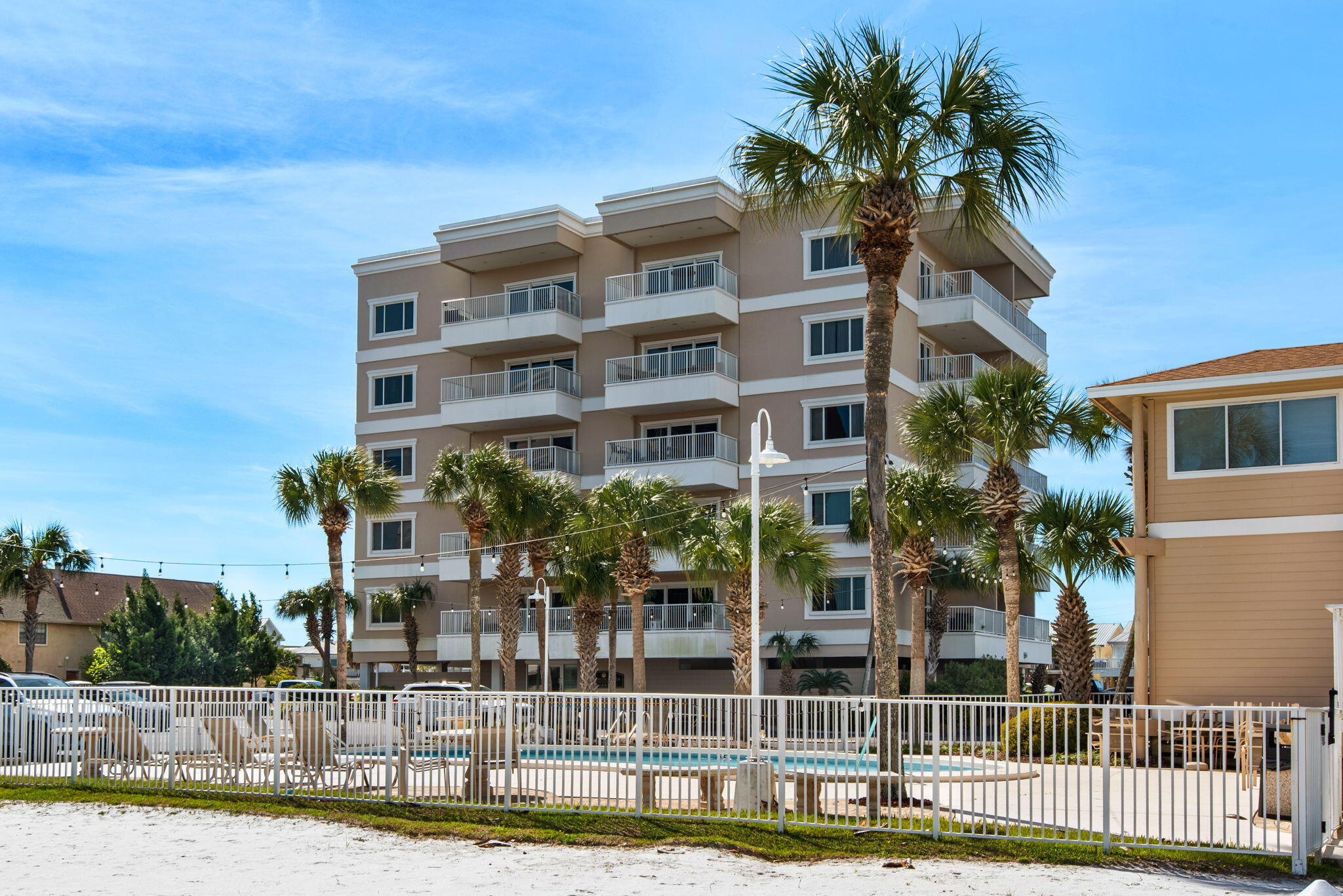 Bring your boat and dock it just outside your condo!  Sound too good to be true?  Located on Holiday Isle -  Sun King is a beautiful, gated community located on the harbor and near all things Destin.  Sun Kings' quiet grounds, complete with a pool, workout room, all purpose center and private boat launch has all you could possibly want...all in one place!  Unit 3B (1356 sqft) has been freshly painted throughout, offers two balconies, two large bedrooms, two nice bathrooms, interior washer/dryer, and the spacious kitchen is open to a light-filled living area. This unit is anxiously awaiting your touch to make it your own.  Boat slips are first come first available for $500/year. *Boat lift is available from seller*  No short term rentals.