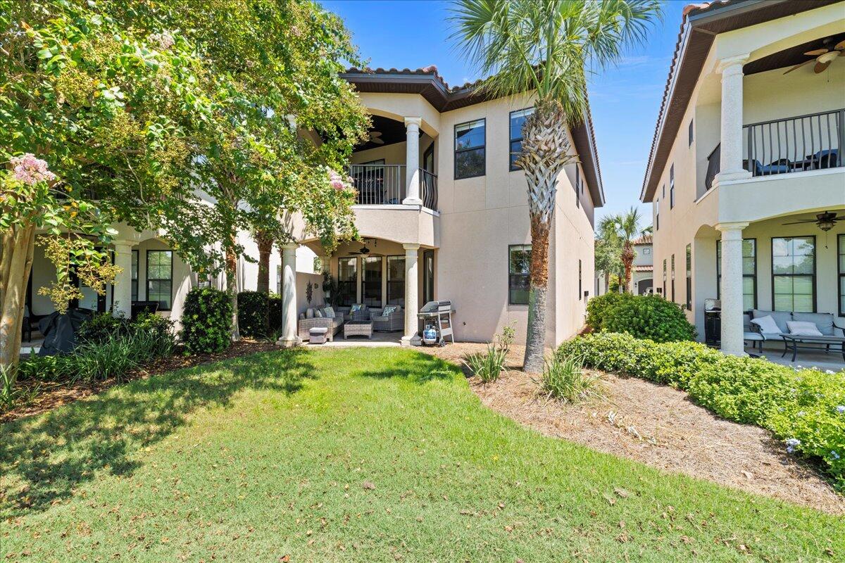 Stop scrolling--the unicorn of the fairway has officially arrived, and it just got a whole lot more AFFORDABLE! If you've been hunting for that perfect blend of coastal cool and golfer's paradise, this is the one you didn't think existed. We're talking about the only home on the course that checks the two biggest boxes on your wishlist: a PRIMARY SUITE ON THE MAIN LEVEL and a private ONE-CAR GARAGE! 

Perched right on the #5 fairway of the Baytowne Golf Course, this isn't just a house; it's a front-row seat to spectacular sunsets and local fireworks displays from your own private patio and balcony. The main floor is a host's dream, featuring an open-concept living and dining space anchored by a chef's kitchen and a dedicated coffee bar for those early tee times. 

Need space for everyone else? Head upstairs to find a second living area and a second primary suite, plus two additional bedrooms with their own en-suite baths. Whether you're looking for a full-time residence or a HIGH POTENTIAL RENTAL, this place is ready to go. It comes fully furnished and--because we know how you want to roll--it includes TWO GOLF CARTS to get you to the beach or the club in style. 

With a fresh PRICE DROP making the deal even sweeter, there's never been a better time to trade your lawnmower for a putter. Come see why life is better on the green.