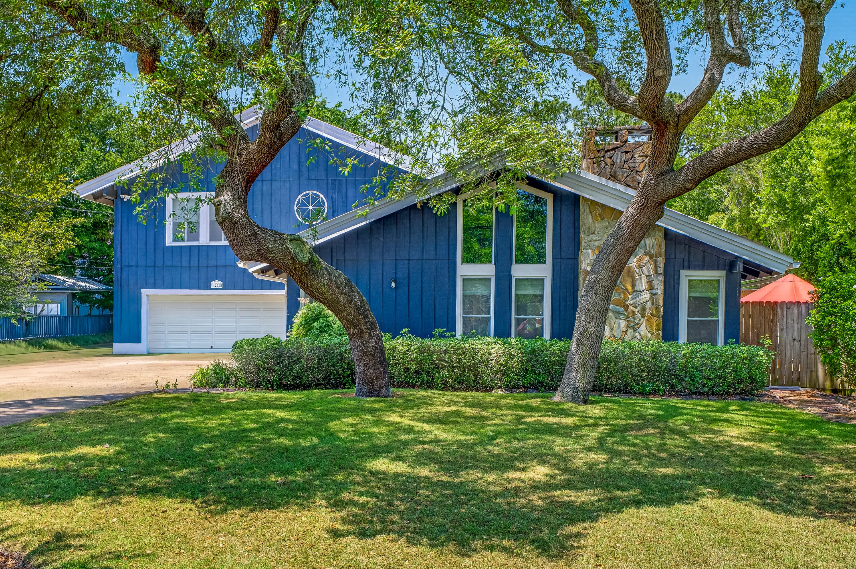 Seller offering $10k toward buyer closing costs, prepaids, or a rate buydown credit.

Situated on a generous half-acre lot (slightly under) in the highly desirable neighborhood of Kenwood. No HOA!
Featuring two stories with vaulted ceilings, natural wood beams, crown molding, and oversized windows allowing natural light in for a fresh, open feel.

Completely updated, New Roof 2021,
HVAC 2021, HWH 2021, Pool liner 2025, 50amp RV hookup, Irrigation system with Wi-Fi timer and private well, double gate with additional parking pad.

Upon entering, there are expansive windows with motorized blinds, cozy seating areas, and an inviting dining area. The centerpiece of the living room features a floor-to-ceiling flagstone fireplace framed by a custom mantle, travertine tile in the entryway, and a tile floor that flows throughout.
Stylishly updated kitchen highlights quartz countertops, a breakfast bar and island, modern ceiling tiles, stainless-steel appliances, and a convenient pantry.
Spacious main-level bedroom suite decorated with ship lap walls, indoor-outdoor access to Florida room, and an adjoining custom spa-like bathroom, complemented by a his-and-her quartz double vanity, oversized closets, cultured marble shower with dual showerheads, and bath heat feature. A separate bonus room provides extra space for everyday living. 
Additional first-floor living space includes an enclosed, heated, and cooled Florida room overlooking the spacious resort-style backyard The upstairs stairway provides access to a loft-style landing area connecting two oversized bedrooms with vaulted ceilings, large closets, and an additional bonus room with endless possibilities for work, play, or relaxation. The upstairs full bathroom has a tiled shower-tub combo, a new vanity, and a Bluetooth fixture. This home includes a spacious upstairs walk-in attic, accessible from the loft.
Step outside to a one-of-a-kind Resort-inspired backyard oasis with multiple entertainment zones, mature trees, zoysia grass, pristine landscape, and backyard paver hardscape, enhanced by an additional pergola with evening lighting. Relax by the stunning 16x32 in-ground (8ft deep) saltwater swimming pool (not heated), featuring a new pool liner, salt cell, new motor, sand filter, and robotic cleaner. Sit by the fire pit, watch TV, or entertain under the stars in an illuminated 20x20 custom Gazebo. 
A 12x24 shed equipped with electric and a large roll-up entry door, and a plastic yard shed provides extra workspace or storage.
Crafted for the ultimate backyard lifestyle and outdoor entertaining aficionados, the custom-built, band-inspired Pool Bar features a 15x13 covered deck, perfect for entertaining guests. Inside, you can cool off with air conditioning, play darts, and have a cold drink from the bar, with a convenient free-standing ice maker and refrigerator.