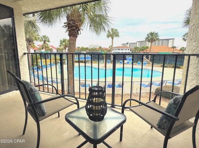 Location, Location!! Pool Villa 2713 just listed for sale at Edgewater Beach & Golf Resort in Panama City Beach, Florida. This isn't just an average condo--it's a lifestyle! Step into the comfort of this sought after beach community. Perfectly positioned over a sparkling heated pool, this fully furnished condo offers the ideal blend of privacy, convenience, and resort style living. Inside, you're welcomed by floor to ceiling windows that flood the spacious layout with natural light. There are shiplap accents, new LVP and ceramic tile flooring to create a welcoming feel that's easy to maintain. The AC is newly installed. A good-sized private balcony extends your living space outdoors--perfect for unwinding after a day at the beach. The large owner's suite is a true retreat, complete with balcony access, a walk in closet, and an en suite bathroom. The big guest bedroom is equally inviting, offering two queen beds, private balcony, and direct access to the guest bath--ideal for hosting family and friends. The equipped kitchen, paired with full size laundry, ensures comfort and practicality for both everyday living and vacation stays. Owning a Villa at Edgewater means embracing a lifestyle centered around relaxation, recreation, and convenience. Enjoy tropical pools, hot tubs, splash pad, golf, pickleball, tennis, fitness facilities, on site dining and market, and private beach access--all within a gated, beautifully maintained resort. Bella Salon services are available by appointment and the resort is walkable to shopping and dining. Rest easy with gated entrances, 24-hour security, building-side parking, vehicle charging stations and parking for RVs, boats, jet skis, trailers. Pet-friendly for owners, with both the dog beach and park just minutes away. Whether you're seeking a personal getaway, a second home, or a rental investment, this Pool Villa delivers the coastal experience so many dream of.