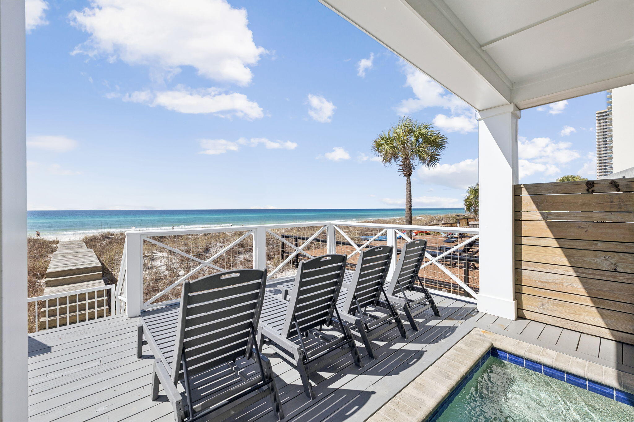 Wake up to uninterrupted Gulf of Mexico views, step onto your private balcony, and hear nothing but waves. 16525 Front Beach Road is a fully furnished, turnkey beachfront home offering 50 feet of pristine Gulf frontage, its own beach walkover right out the back door over the dune, a heated pool, and rental projections of $359,000 annually with accommodations for up to 22 guests. Whether you're seeking a high-performing vacation rental on the Emerald Coast or a legacy Gulf front family retreat, this property delivers on every level.
Maintained in like-new condition and offered fully furnished, this Gulf front home is move-in ready. With strong rental projections and capacity for large groups, it presents a compelling opportunity for investors seeking a premier beachfront vacation rental on the Emerald Coast. Designed to maximize Gulf views, the home features three expansive balconies connected by a spiral staircase, creating multiple outdoor living spaces with panoramic water views. Two Gulf-facing primary bedrooms open directly to their own balconies, letting guests wake up to the sound of waves and unobstructed views of the Gulf of Mexico.
The second floor serves as the main living level, where an open-concept kitchen, dining, and living area flows seamlessly to a large balcony overlooking the beach. The kitchen is built for entertaining, featuring quartz countertops, custom cabinetry, a tile backsplash, a large island with seating for six, gas range, built-in ice maker, and double sinks.
The first floor is designed for gathering and recreation, with a bunk room and recreation room that opens directly to the heated pool area. A built-in bar with ice maker and beverage refrigerator creates the perfect setup for poolside entertaining after a day on the beach.
The primary suite offers Gulf views, a balcony, walk-in closet, double vanity, garden tub, and separate shower. Throughout the home you'll find shiplap accent walls, ensuite bathrooms in every bedroom, generous owner storage closets on each floor, and integrated WiFi extenders with indoor and outdoor speakers.
Outside, a beach walkover, outdoor shower, Polywood outdoor furniture, and abundant parking round out a package that is rarely found in Gulf front homes. Positioned on a quiet stretch of beach with no nearby public walkovers, the shoreline here stays uncrowded, giving guests the feel of a private beach just steps from the door, while still being just minutes from Pier Park's restaurants, shopping, and entertainment.
16525 Front Beach Road is a rare Gulf front home where luxury amenities, an unbeatable location, and exceptional vacation rental income potential come together in one standout beachfront property.
