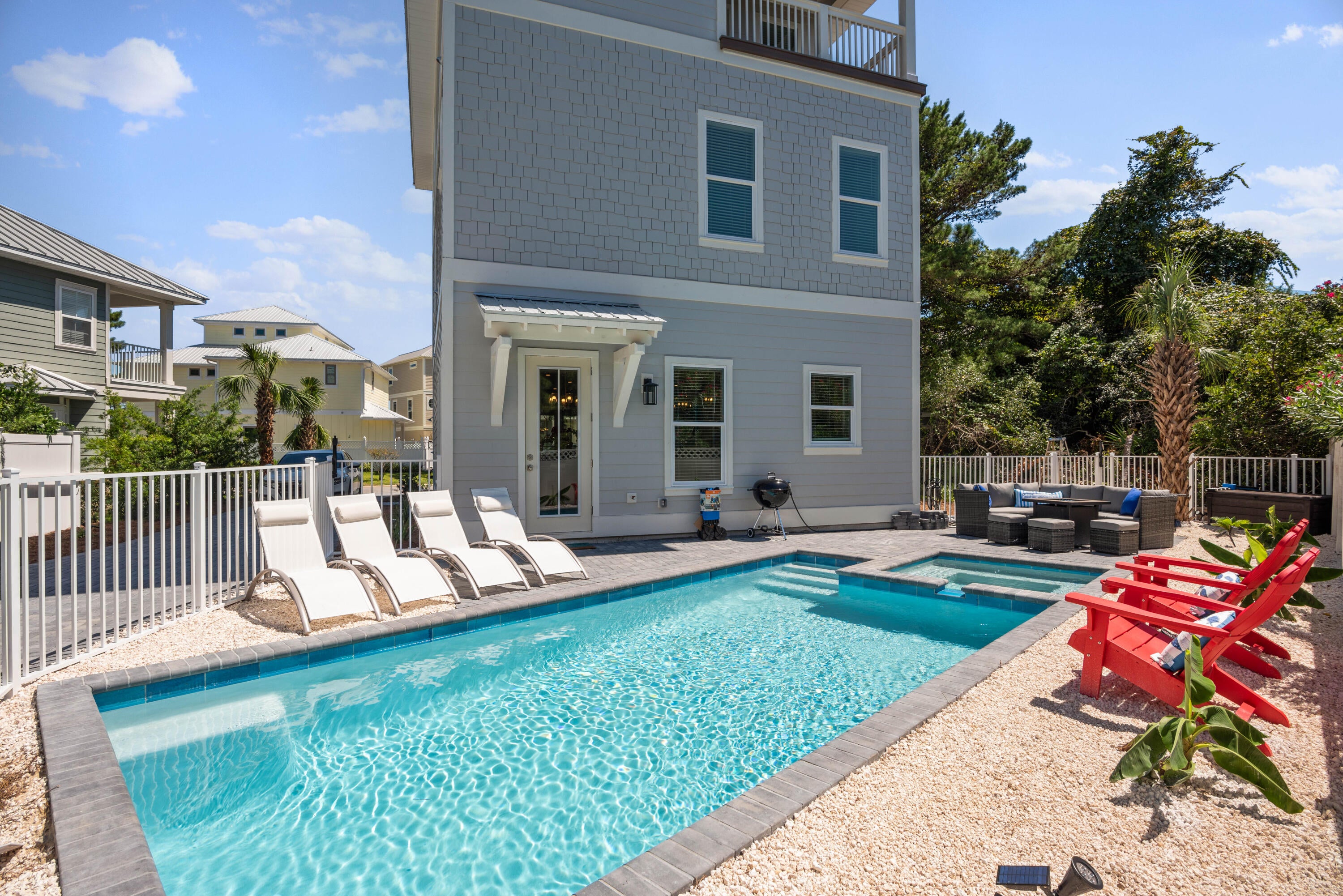 Experience the charm of 103 St Simon, a luxurious 5 bedroom, 4.5 bath getaway in Miramar Beach, built with comfort and style in mind. Spanning three levels and over 2,900 square feet, this beautifully appointed home is just a quick walk or golf cart ride from the pristine white sands of the Emerald Coast and includes a private beach access for Emerald Waters Village. **This home is being sold fully furnished with a golf cart.. Turnkey ready for your family vacations** As you step inside, you're welcomed by an open living space designed for both comfort and entertaining. The living room features a striking shiplap accent wall with a cozy fireplace to enjoy your evenings. Just off the main living area, a stylish wet bar complete with a sink and wine cooler makes hosting effortless. In the kitchen, elegant quartz countertops provide both beauty and durability, while coffered ceilings add architectural detail and character. The quartz island serves as both a prep space and gathering spot, featuring a built-in sink, microwave built into the island, and comfortable bar seating for casual dining or morning coffee convos. The kitchen is also equipped with stainless steel appliances, a professional-grade gas range, and a vented range hood perfect for cooking in. 

Step outside to your own private resort-style retreat! The fenced in backyard features a heated saltwater pool paired with a waterfall spa. A fire pit lounge with comfortable seating invites late-night conversations, while the gas grill and outdoor dining area make it easy to enjoy meals in the open air. Framed by palm trees and lush landscaping, the space offers a peaceful, tropical backdrop perfect for both lively gatherings and quiet afternoons by the water.

On the second floor, two queen bedrooms and a custom-designed bunk room (with pacman machine) are well-suited for families or groups. The laundry is conveniently located near all of the bedrooms. Home comes with a tankless gas Ranai for unlimited hot water for large groups. 

On the third floor, there are two spacious king suites which include private ensuite bathrooms and covered porches. The main master bath features a clean, modern design with high-end finishes throughout. A freestanding soaking tub is positioned beneath two windows, bringing in natural light and offering a relaxing place to unwind. Next to it, a frameless glass walk-in shower includes marble-look porcelain tile, a built-in niche for storage, and a mosaic accent wall for added detail. The bathroom also offers separate his and her sinks with quartz countertops. 

103 Saint Simon is the perfect second home for families with great rental numbers and projections. Schedule your showing today!


**Furnishings may have a few slight differences than the photos (I.e. bed coverings, etc) **
