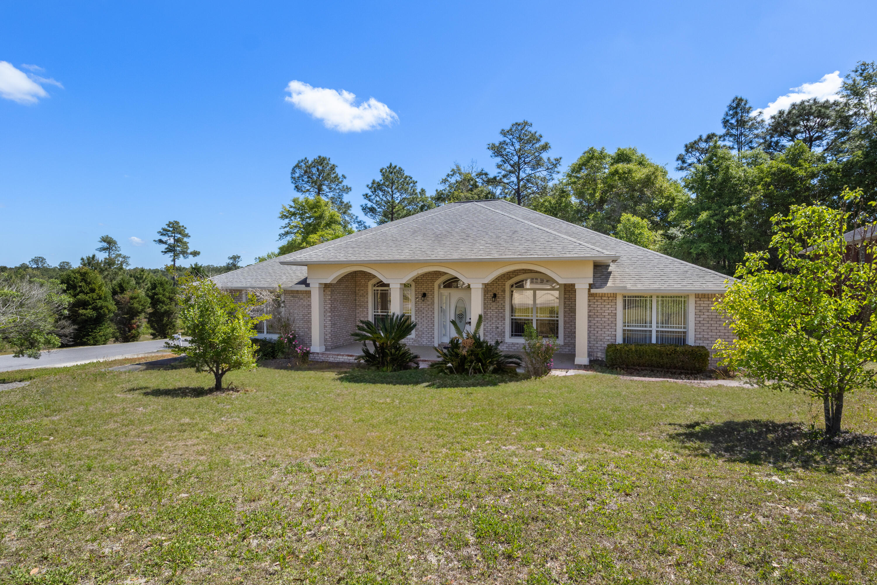 Welcome to South Crestview's Fox Valley! An easy commute to Eglin AFB/7SFG/Duke Field! This all brick, 3000sf, 4 bed, 3 FULL bath home has an office & a big bonus room! each behind a set of french doors. Corner lot + oversized 29' driveway w/ side-entry garage. Open floorplan w/10'4'' ceilings & spacious rooms sizes! Kitchen hosts granite counters, under-cabinet lighting, walk-in pantry, island, upgraded slow-close cabinets, and GAS stove. Huge primary suite w/ backyard access, trey ceilings, dual walk-in closets, soaking tub & walk-in shower. Enjoy a massive covered front porch. Fenced in yard, 12'x25' covered back patio w/fans, plus 12'x20' paver uncovered patio. Generac natural gas GENERATOR + irrigation well. Community Kids playground and picnic area! Schedule your showing today!