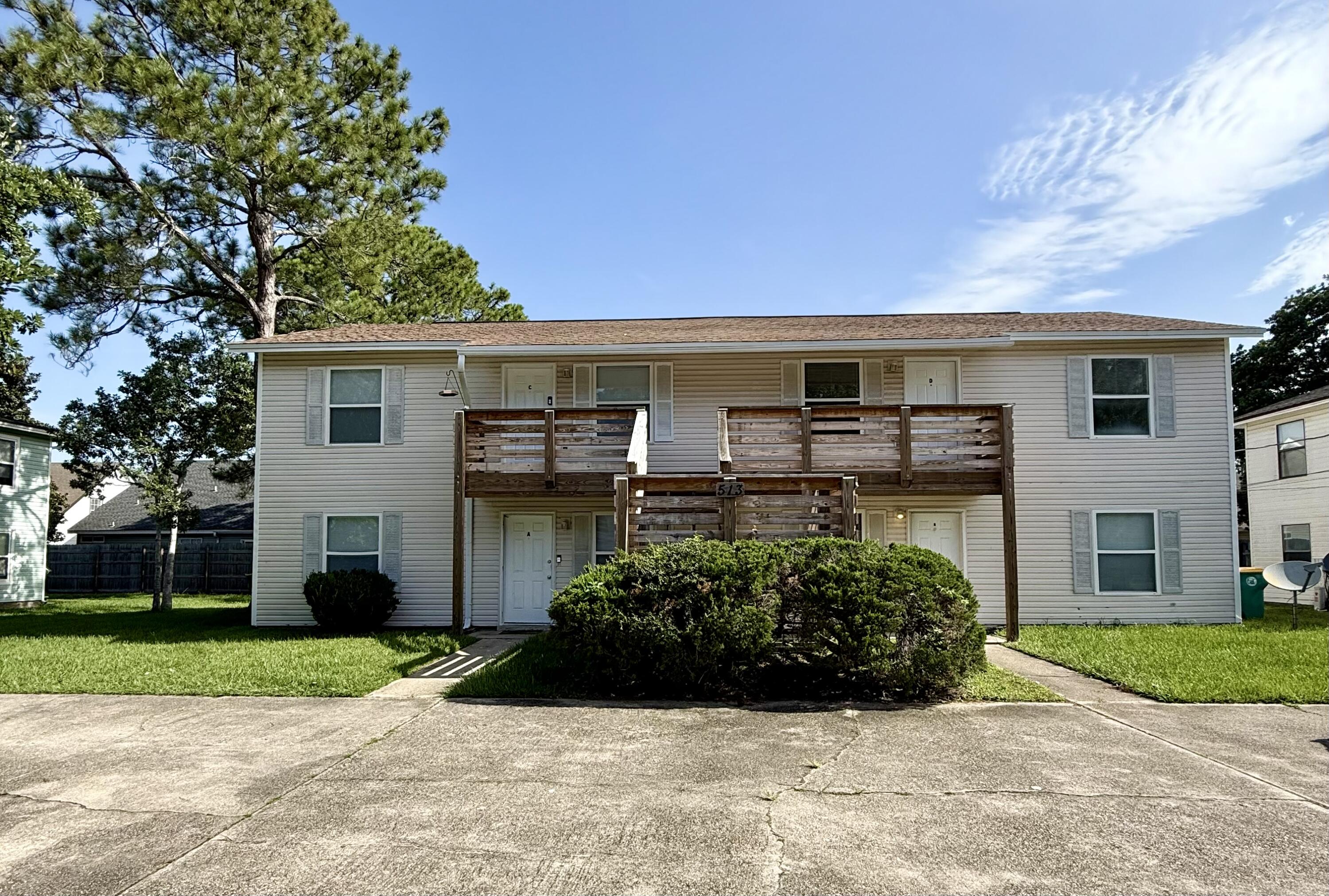 Large Living room area in this first  floor unit.  Same tile throughout the unit.  The unit  also has a back patio and an additional storage.