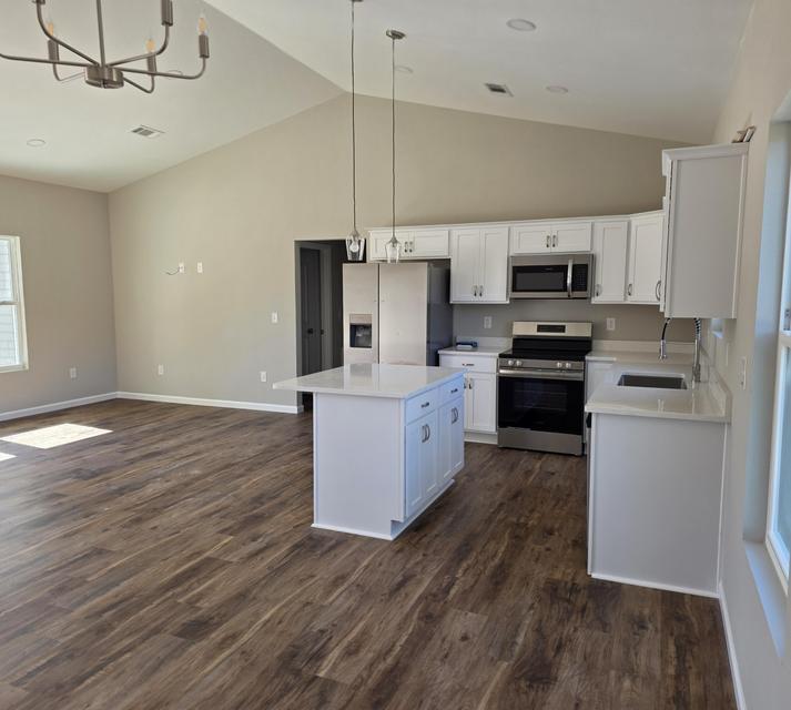 Preferred lender incentive available!
Qualified buyers may receive a lender credit toward a permanent interest rate buydown--helping make this beautiful new home even more affordable. Discover this spacious new construction home featuring a desirable split floor plan with 3 bedrooms and 2 bathrooms, offering a total 2,306 sq ft of comfortable living space. Nestled on a beautifully wooded 1.31-acre lot, this property provides the perfect balance of privacy and natural surroundings. Step inside to an open-concept layout filled with natural light, ideal for both everyday living and entertaining. The expansive kitchen offers plenty of space to gather and create lasting memories. The primary suite is a true retreat, complete with a walk-in closet and a luxurious ensuite bathroom featuring a stand-alone soaking tub and separate tile shower.
Enjoy peaceful outdoor living with a covered front porch and a 14' x 12' back deck, perfect for relaxing mornings or quiet evenings overlooking serene wooded views. Additional features include an attached garage with attic access, providing ample storage space. This area is experiencing exciting growth, with increasing job opportunities driven by major developments such as the Amazon Distribution Facility and the River Ranch Aerospace Manufacturing Project--both contributing to rising property values and long-term investment potential. Enjoy the peace of country living while remaining conveniently connected. This home is just a short drive to Crestview, Fort Walton Beach, and Destin, with easy access via Highway 90 and nearby interstate routes. Experience country living with modern comfort--don't miss this opportunity! All plans, features, and specifications are subject to change at the builder's discretion without prior notice, and may not be known to the listing agent at the time of change. Note: Photos may not reflect the new build specs. This is the same house plan, but builder will and or may make some changes during build