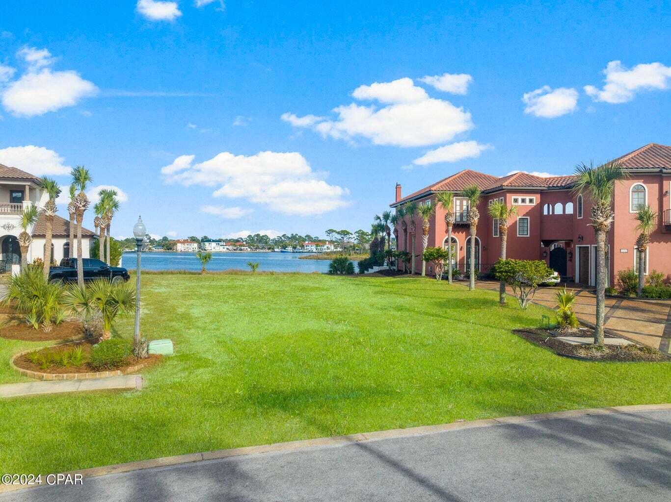 Exclusive Waterfront Lot in Finisterre Gated Community with Gulf Access Experience the epitome of waterfront living in the prestigious Finisterre neighborhood with this extraordinary residential lot. Located within a secure gated community, this property offers the ultimate blend of privacy, luxury, and direct access to the Gulf of Mexico. Situated along approximately 165 feet of pristine water frontage, this lot boasts panoramic views and is preapproved for the construction of a private dock, making it a paradise for boating enthusiasts. Enjoy tennis courts, basketball courts, and community dock.