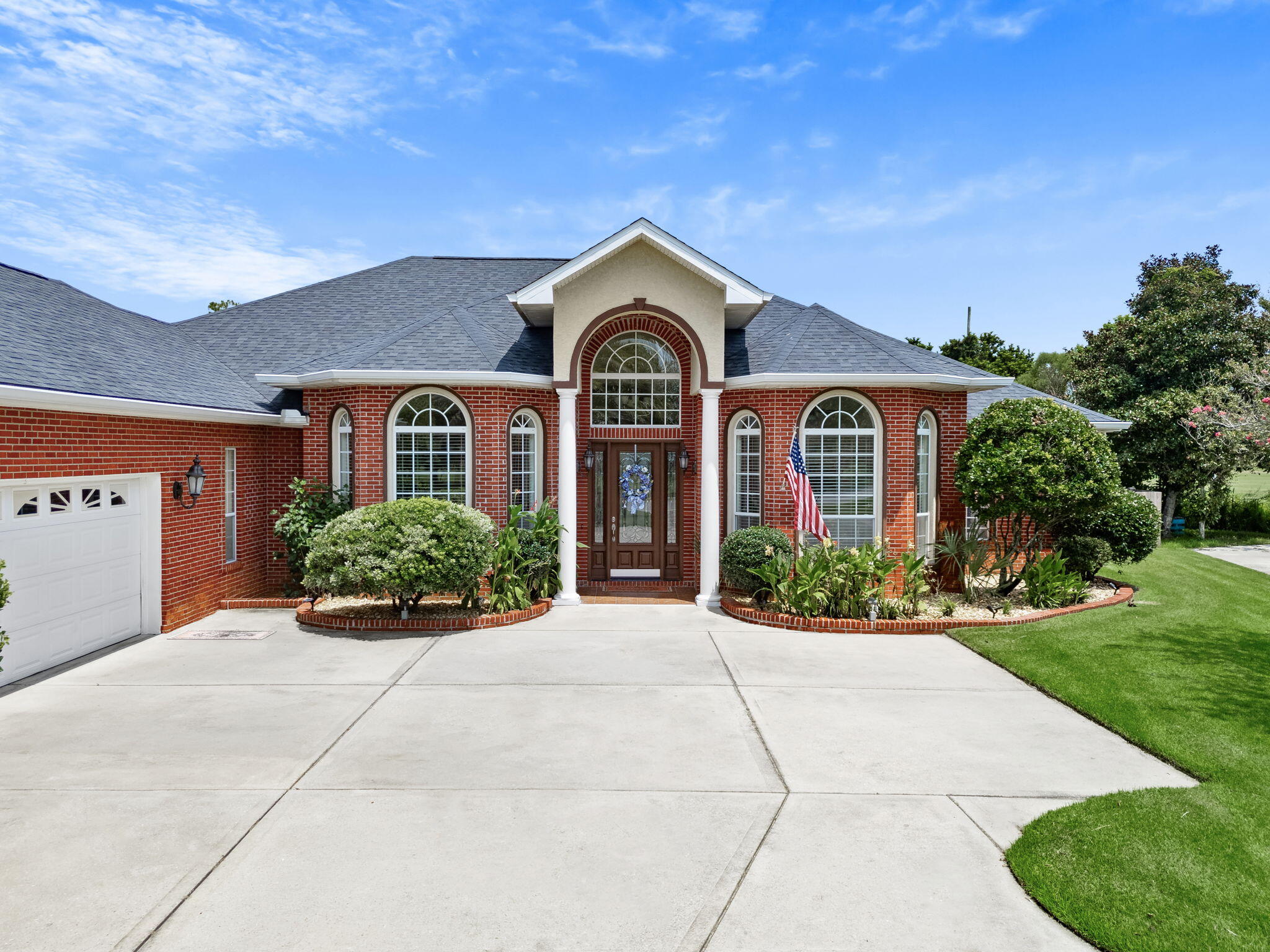 Located in the desirable Landings subdivision, this executive home, built by Tom Gladstone, showcases quality craftsmanship and thoughtful details throughout. Engineered hardwood flooring flows through the main living areas, while a detailed ceramic tile design beautifully defines the formal dining space. Plantation shutters throughout provide timeless style and added privacy. The inviting living area features a gas fireplace, while the well-appointed kitchen offers granite countertops, stainless steel appliances, a gas range, and two pantries for abundant storage. The versatile fourth bedroom, complete with a full bath, offers flexibility as a private home office or guest suite. Bedroom closets feature additional storage space above, providing even more room for organization. The luxurious primary suite is a true retreat, featuring detailed ceilings, a jetted Jacuzzi tub, a private water closet with bidet, dual vanities with granite countertops, and separate his-and-hers closets. The garage features a nicely coated floor for a clean, finished look. Outdoors, enjoy the screened lanai with brick pillars overlooking the in-ground saltwater pool and beautifully maintained landscaping. A rear gate provides convenient access to the golf course and walking trails. From the detailed interior finishes to the inviting outdoor living space, this well-maintained, move-in-ready home has so much to offer. Survey available. If measurements are deemed important, please verify Furnishings Negotiable!