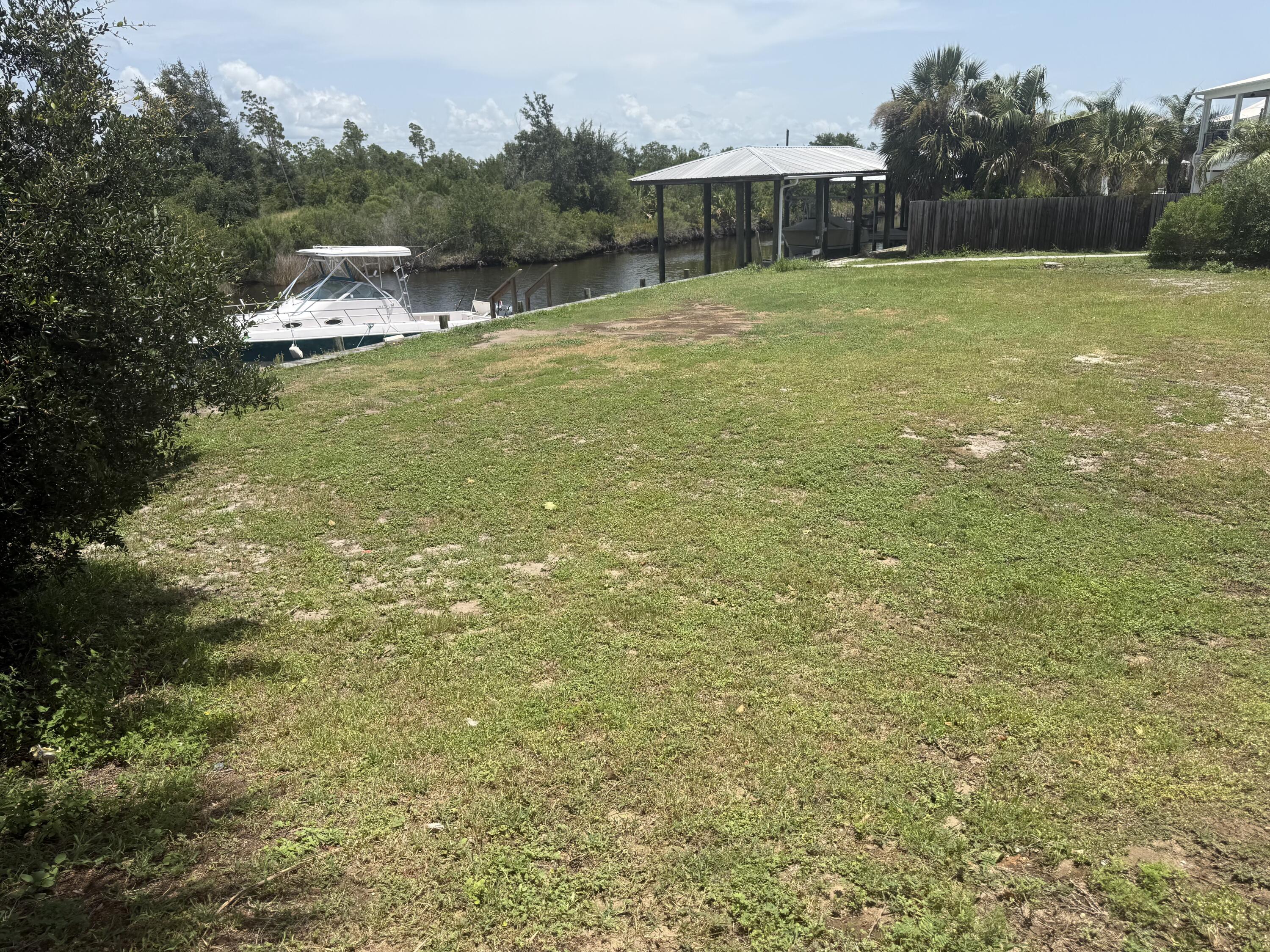 Build your dream coastal retreat on this desirable canal-front lot in beautiful Mexico Beach, Florida. Offering direct water access to the Gulf of America, this property presents an exceptional opportunity for boating, fishing, kayaking, and enjoying the laid-back waterfront lifestyle that makes this community so special. With approximately over 100' of seawall and dock in place, one can save tens of thousands of dollars for improvements. Imagine stepping from your future home to your boat and heading out for a day on the open water. Conveniently located near the sugar-white beaches, local restaurants, shopping, parks, and other community amenities, this homesite is well suited for a primary residence, vacation getaway, or investment property. The canal frontage adds tremendous appeal for buyers seeking easy access to world-class fishing and boating while remaining close to everything Mexico Beach has to offer. Enjoy peaceful mornings by the water, unforgettable sunsets, and the relaxed atmosphere of one of Florida's most charming coastal communities. With nearby access to Port St. Joe and Panama City, you can enjoy a quiet beach-town setting without sacrificing convenience. Whether you envision a custom waterfront residence, second home, or vacation rental, this property provides an outstanding canvas for your coastal vision. Canal-front opportunities with access to the Gulf of America are increasingly limited, making this a chance you will not want to miss. Per the owner; Seawall was reinforced about 2 to 3 years ago. Sewer and water tap convey with the sale. The city of Mexico Beach has stated verified that two homesite are possible since the parcel contains two platted lots. Some dimensions were obtained by the Bay County Property Appraiser's website, Please verify if important.