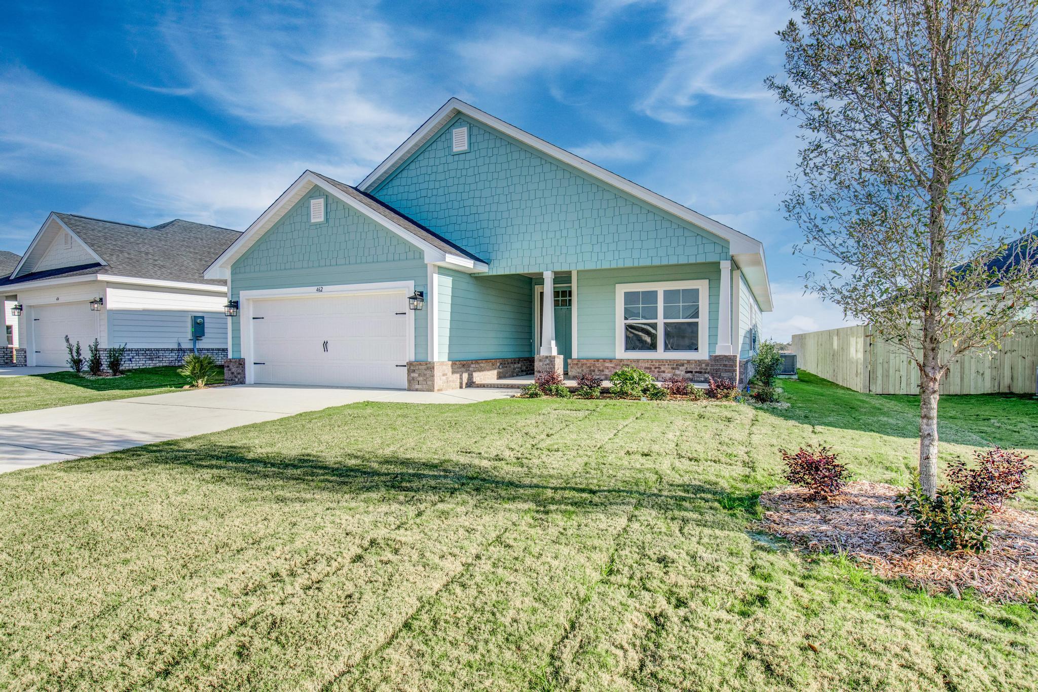 This popular Craftsman-style 4BR/2BA home (currently under construction: (Est. August / Sept. N ext to the entrance of the community (next to model). Designed with both comfort and style in mind, the home features HardieBoard® siding with a brick skirt, vaulted ceilings,  and CoreTec Pro Plus luxury vinyl plank flooring throughout--no carpet. The spacious primary suite boasts elegant tray ceilings, a generous walk-in closet, and a spa-inspired bath. Quartz countertops in the kitchen and baths, soft-close cabinetry, spacious covered patio complete this inviting home, perfect for relaxed everyday living and entertaining. Bluffs residents enjoy a community pool, and bathhouse, near the Florida Trail offering plenty of opportunities to get outside and enjoy the Florida life style.  *Pics are of a similar home.*