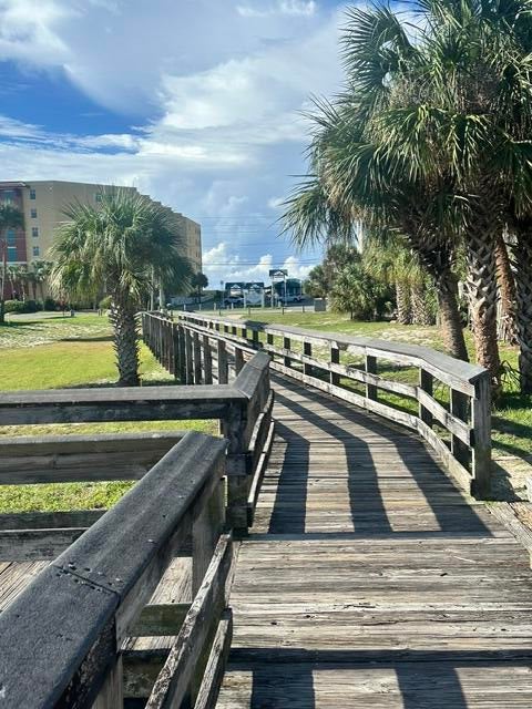 LOCATION, LOCATION, LOCATION! This charming ground-floor 2-bedroom, 1-bath unit is tucked away in a smaller, more intimate complex and offers an incredible opportunity just steps from the beach. Enjoy direct boardwalk access to the sand and surf, while restaurants, shopping, and other beach-area amenities are all within easy walking distance.

The unit features a convenient ground-floor layout, updated appliances, and reserved parking directly in front--making everyday living and beach trips effortless. This property has historically been used as a long-term rental, with an established rental history, while its prime beachside location offers exciting potential for short-term rental income, subject to applicable local regulations and association restrictions.

Whether you're looking for a beach getaway, investment property, or a low-maintenance coastal home, this property offers the location and flexibility you've been looking for. Bring your beach chair and take advantage of everything this sought-after location has to offer!