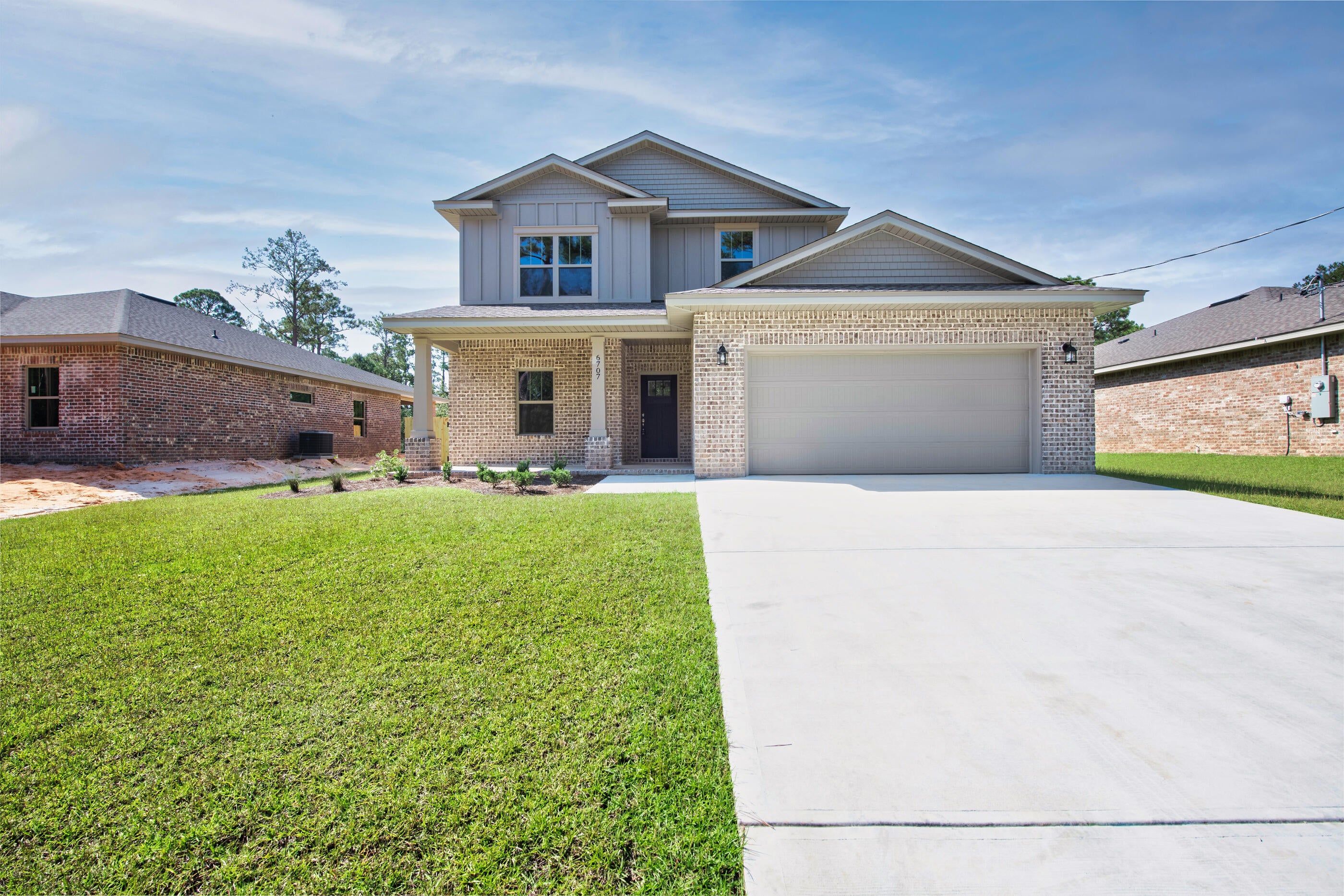 Home is complete and ready to close! Builder offering $10,000 in buyer concessions! No wetlands and located in an X-flood zone, this exceptional new home with many upgrades throughout. Clad with the timeless durability of brick, cement fiber board, and an architectural shingled roof. Sprinkler system and fenced backyard come standard! Interior offers luxury vinyl plank flooring in the first floor common areas, visually pleasing neutral tile in the baths and laundry room, and carpet in the bedrooms. Custom paint color is accented with a wide baseboard, beautiful crown molding, and spectacular tray ceiling accents in the first floor owner bedroom and dining room. Additional bedroom and full bath also located on first level. Stainless steel appliances including refrigerator, stunning shaker style cabinets, and quartz countertops throughout finish the home exquisitely.