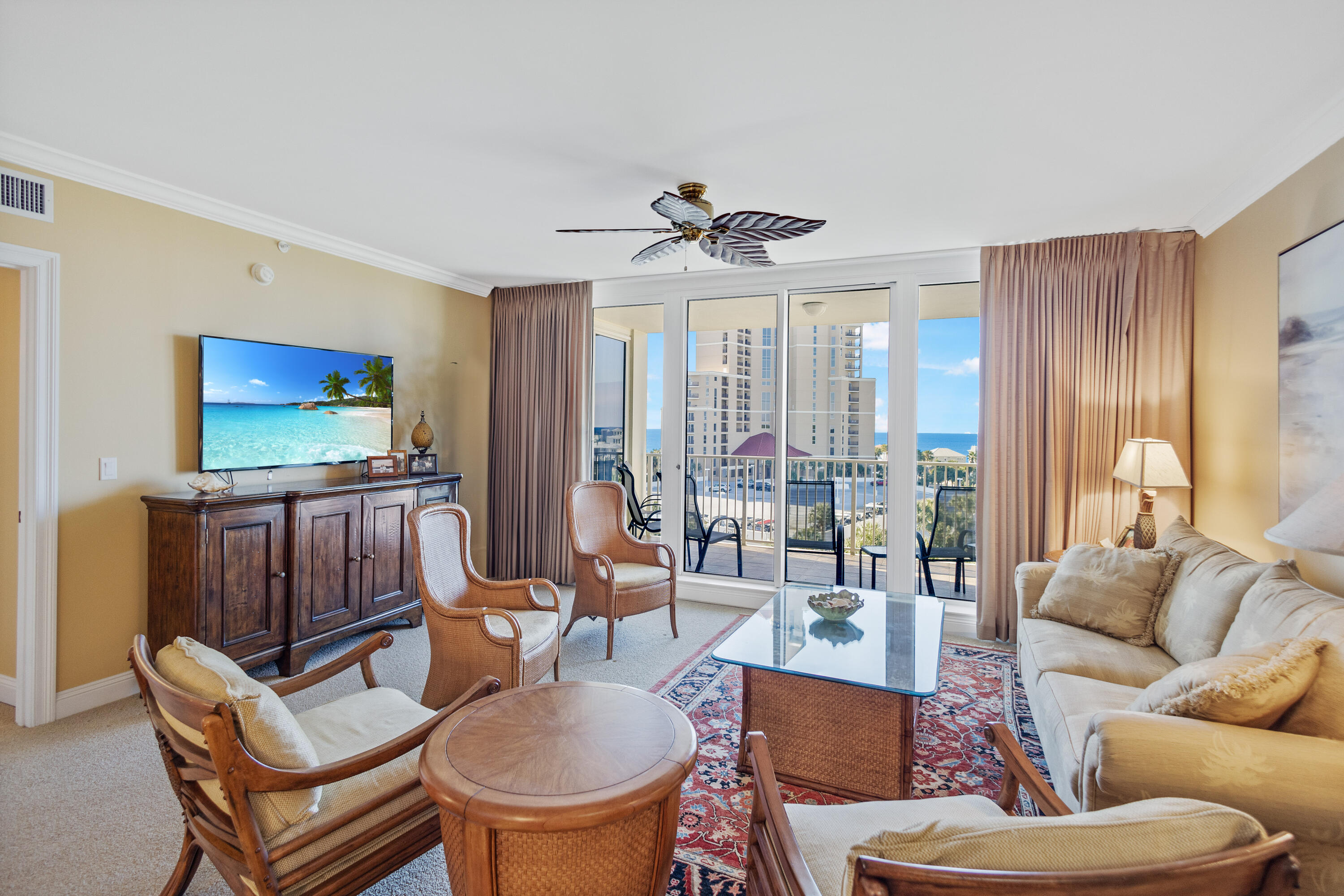 Welcome to an exceptional coastal residence in the prestigious One Beach Club Drive, ideally located within the renowned Sandestin Golf & Beach Resort. This spacious 3-bedroom, 3-bath luxury condominium offers approximately 1,833 square feet of beautifully designed living space--an increasingly rare find of this size along Sandestin's coveted beachside. Upon entering, you're immediately drawn to the dramatic floor-to-ceiling windows that fill the home with natural light and create an open, airy ambiance throughout. The expansive layout lives more like a single-family home than a traditional condo, offering both comfort and sophistication at every turn. The main living area flows seamlessly to a generous private patio, perfect for entertaining or simply relaxing in the coastal breeze, with direct access to the pool area for effortless enjoyment of Florida's outdoor lifestyle. The balcony serves as a true extension of the living space, blending indoor and outdoor living with ease. Adding to the home's charm, the guest bedrooms and kitchen overlook a  picturesque lake, creating a serene and tranquil backdrop for daily living. This exclusive, non-short-term-rental building ensures a quiet, private environment, enhancing the sense of luxury and retreat. Inside, elegant travertine flooring spans the main living areas, complemented by all-new window treatments that add a refined finishing touch to this exceptional residence.

As an introduction to the Sandestin lifestyle, we invite our new owners to explore amenities that make Sandestin special. The listing brokerage and seller(s) are presenting the buyer(s) of this property with (2) 90-minute rounds of Tennis court time, a golf foursome at one of our three championship courses, and a round of golf for up to four (4) players at the unrivaled Burnt Pine Golf Club.

Sandestin Golf and Beach Resort features more than seven miles of beaches and pristine bay front, four championship golf courses, 15 world-class tennis courts, a 226-slip marina, a fitness center, spa and celebrity chef dining. Shop, dine and play at the charming pedestrian village, The Village of Baytowne Wharf and more. Inside the gates of the resort, residents enjoy a balanced lifestyle of high-class living, spanning the 2,400 acres from the beach to the bay. Everything within the gates of the resort is accessible by golf cart or bicycle. The entire resort is interconnected by miles of pedestrian, bike and golf cart paths that weave through groves of live oaks, meandering past natural lagoons, fountains, man-made lakes, and meticulously landscaped fairways.