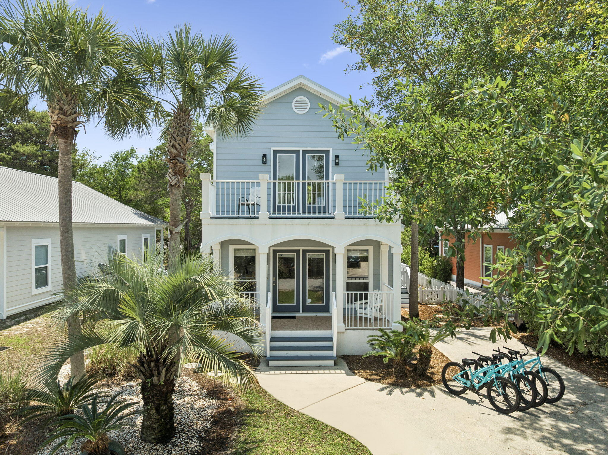 Experience the Emerald Coast in this updated, natural light-filled cottage located in the quiet enclave of Ventana Dunes. Designed with both comfort and style in mind, the open-concept main floor offers a seamless flow between the living area, dining space, and a kitchen featuring a functional breakfast bar. A standout feature of this floor plan is the first-floor bedroom and full bathroom, providing exceptional flexibility for guests or a home office.
The second floor is a private retreat, highlighted by a spacious primary suite that opens through double doors to a wide covered front balcony--the perfect spot to take in the coastal air. The exterior of the home is equally impressive, featuring a private, fenced-in backyard with a lush lawn, side decking for entertaining, and a a classic white picket fence. Located just a short stroll from the sugar-white sands of Blue Mountain Beach, this home is a turnkey opportunity to own a piece of the 30A lifestyle.