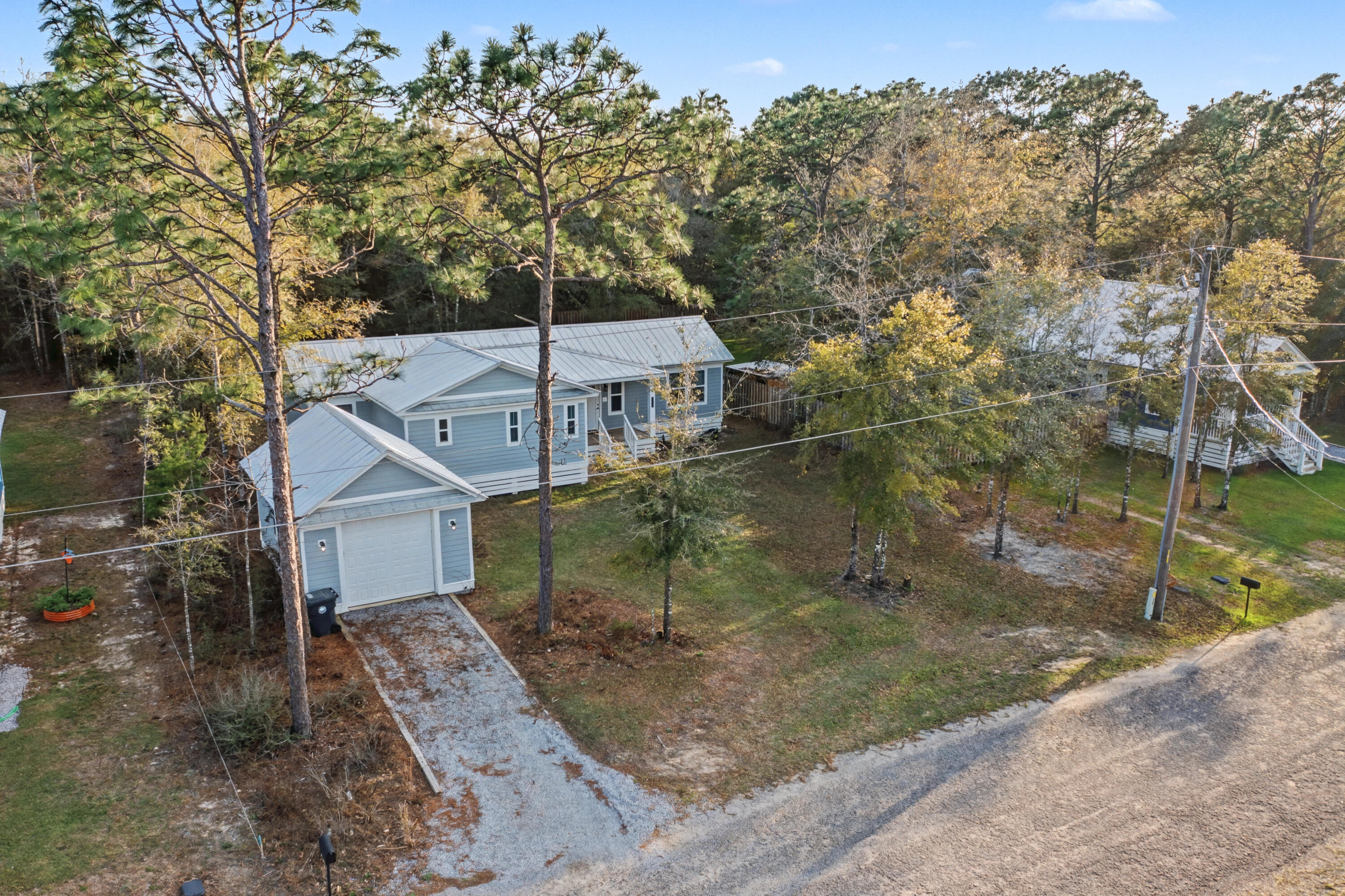 *New Price Improvement & Motivated Seller!* Discover the charm of this newer 3-bed, 2-bath home tucked within a sought-after lake community. The open-concept design creates a bright, seamless flow--perfect for everyday living and entertaining. A rare bonus, the heated and cooled detached 1-car garage provides an ideal space for a workshop, hobby room, or year-round storage. Out back, the wooded yard offers natural privacy and a peaceful retreat. Whether relaxing indoors or enjoying the tranquil outdoors, this home delivers comfort, convenience, and a true sense of escape.