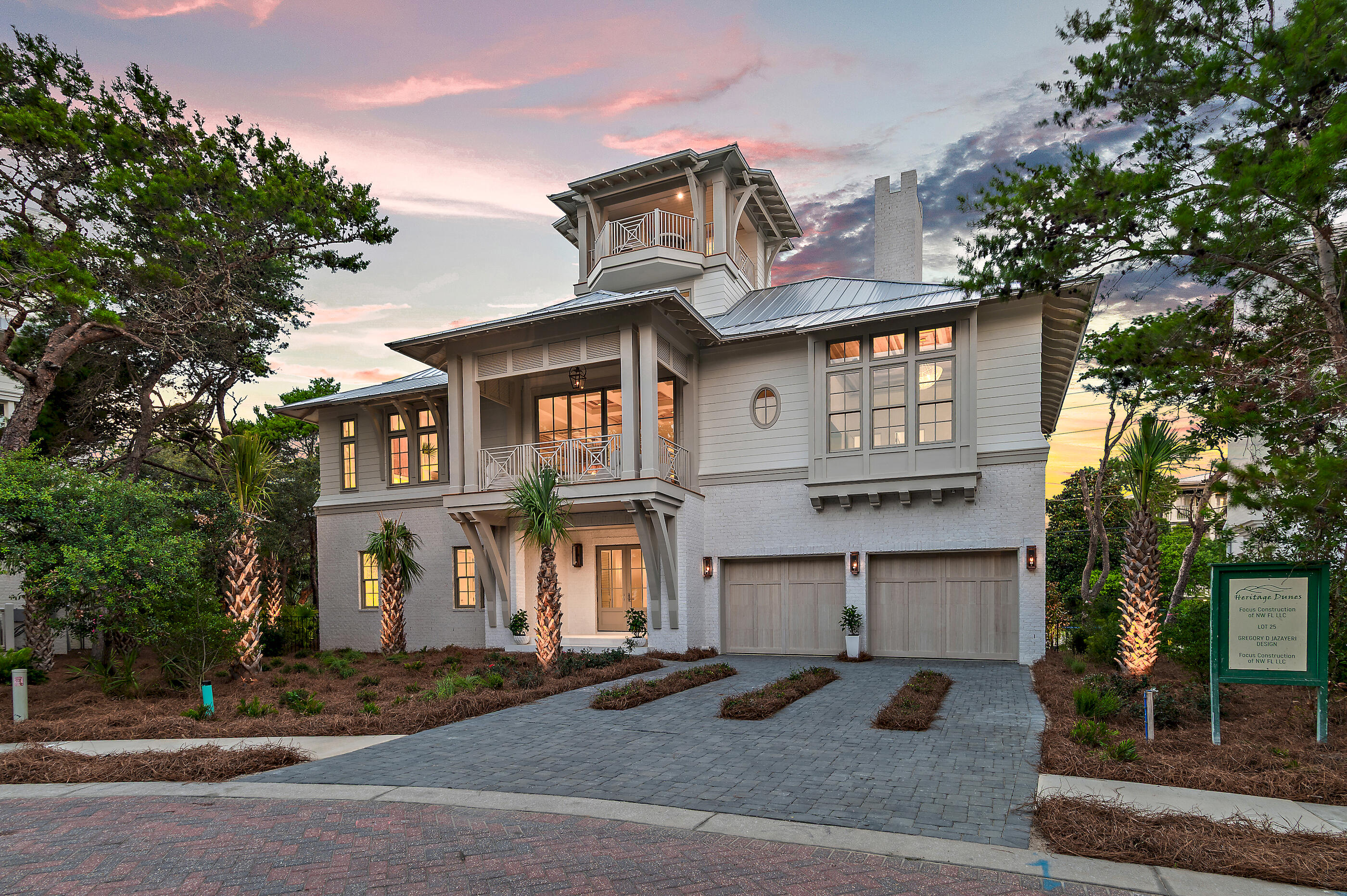 Brand new construction positioned within the private non-rental and gated enclave of Heritage Dunes, this newly constructed Greg Jazayeri design executed by the renowned team at Focus Construction seamlessly blends organic aesthetics with breathtaking views of the Gulf and surrounding topography. A stately paver driveway and lush, curated landscaping create a warm and elegant arrival. Inside, the rotunda-style foyer immediately captivates with soaring poplar ceilings and rich European hardwood and peacock paver flooring carried throughout the residence, establishing a refined yet inviting aesthetic. There are three spacious junior suites each equipped with a private en-suite boast floating vanities, beautifully tiled showers, and custom built-in closets. The entertainment room provides the perfect poolside retreat, while the outdoor oasis beckons for evenings outdoors with outdoor kitchen. A mudroom with laundry, elevator, and 2-car garage complete this level.

Ascending via elevator or the striking wood staircase accented with custom metal detailing, the second level unfolds into an extraordinary open-concept living and dining space. Defined by soaring ceilings, 12-foot coffered details, and a statement fireplace, the main living area is both sophisticated and welcoming, with walls of glass framing the tranquil treetops and Gulf vistas.

Ideal for culinary enthusiasts, the gourmet kitchen encompasses custom cabinetry, stunning Taj Mahal Quartzite countertops, an extended kitchen island with integrated seating, and a luxury appliance suite. The fully equipped scullery enhances both function and style, complete with a prep sink and adjacent wet bar with wine refrigeration, and abundant storage. Adjacent to the kitchen, the dining area features vaulted wood ceilings and opens seamlessly onto the spacious covered terrace, beautifully blurring the boundary between indoor and outdoor living.

Anchored by a wall of windows showcasing views overlooking the tree line, the bright and airy main suite situated on the second level is synonymous with relaxation and a true oasis that is framed by expansive windows overlooking the natural landscape. The suite features warm wood accents, custom ceiling details, and designer lighting. The attached sumptuous ensuite creates a spa-like experience with a freestanding soaking tub, honed-marble tiled walk-in shower with seating, and a separate water closet. 

Perched atop the roofline, the viewing deck provides an astonishing vantage point to admire the picturesque Gulf-views and everchanging palate of mesmerizing hues emitted by the renowned Emerald Coast sunsets each and every night. Right before, stop by the fully equipped wet bar perfect for preparing a morning beverage or evening night cap.

84 N Heritage Dunes is professionally curated, designed, and built for comfort and entertaining. This is a rare opportunity to own in an intimate non-rental gulf-front community, built for exclusivity. Residents and guests enjoy heightened privacy, and an array of amenities, including private gated entry, a spacious Gulfside pool, and over 200 feet of private beach frontage all while remaining geographically poised near all of the acclaimed dining and entertainment venues 30A has to offer including the newly opened Greenway Station town center.