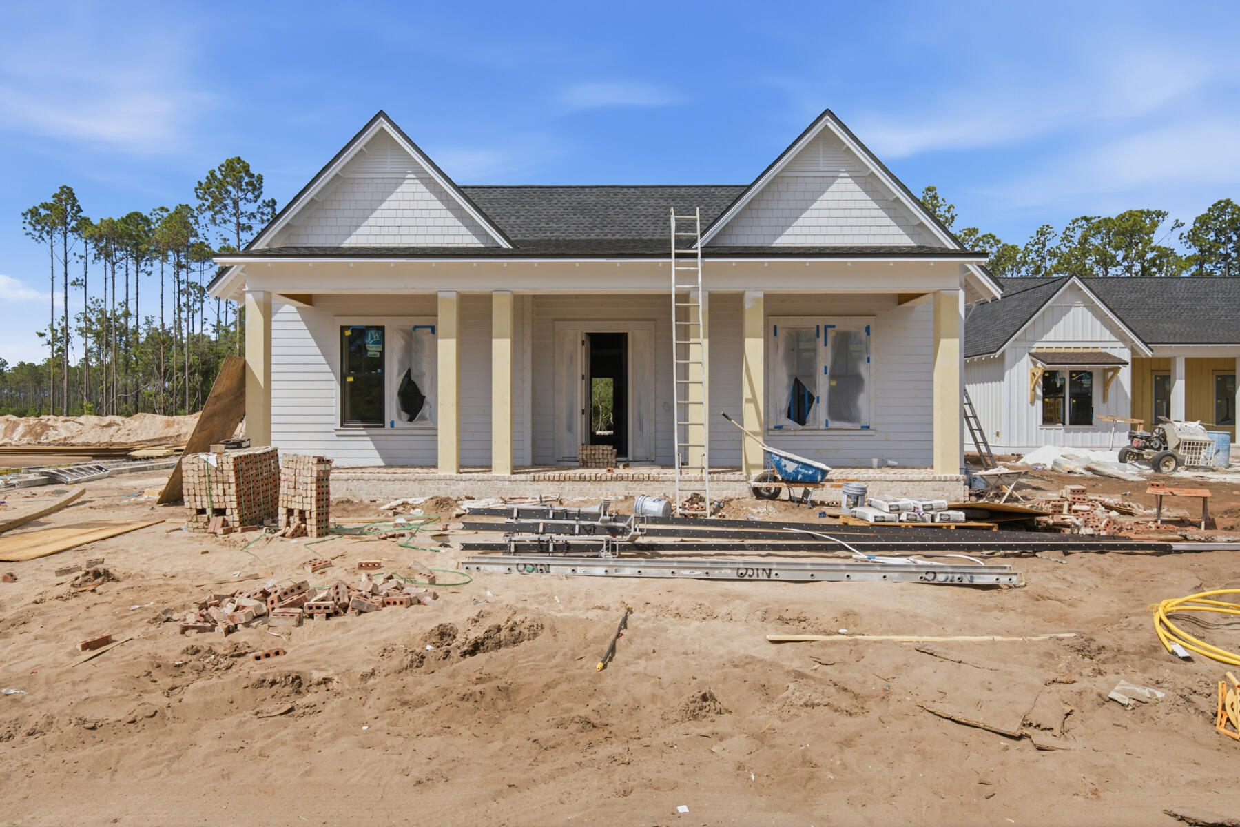 The Ficus rear-load garage plan in the Preserve Collection at Arborview Park offers 2,685 square feet, 4 bedrooms, 4.5 bathrooms, and an expanded rear-load 2.5-car garage connected to the home by a covered walkway. Located on a 65' x 159' homesite, the layout is designed to balance open gathering areas with separation between the primary suite and secondary bedrooms. Estimated completion is end of Sept. '26.

The foyer opens into the central living space where the kitchen, dining, and living areas connect beneath 11-foot ceilings with clear sightlines to the rear porch and pool area. A 12-foot bronze slider door extends the living space outdoors, creating a direct connection to the screened porch, saltwater pool and spa, expanded paver deck, and fenced backyard. The outdoor layout is designed to take advantage of the depth of the homesite while maintaining privacy and usable yard space.

The kitchen is positioned at the center of the home and includes a white oak island, quartz countertops, stacked glass cabinetry, custom wood hood vent, under-cabinet lighting, walk-in pantry, and an upgraded appliance package with a Wolf dual fuel range, microwave drawer, Sub-Zero refrigerator, vent hood, and Cove dishwasher. Wide-plank Medallion wood flooring continues throughout the home, complemented by crown molding, lap and gap detailing on all walls in living room and entry hallway, bronze windows, and upgraded shaker-style interior doors. The primary suite is privately positioned on one side of the home and includes a freestanding tub, walk-in shower with handheld fixture, custom closet built-ins, and a framed full-size mirror. Secondary bedrooms are arranged separately with direct bath access, supporting both guest accommodations and everyday functionality.

Additional features include painted wood shelving throughout closets and pantry spaces, laundry cabinetry with sink and countertop, generator prewire and gas line, pre-plumbing for water filtration, framed TV boxes, Decora switches, impact-rated windows and doors, tankless water heater, CAT6 wiring, and irrigation with landscaping package.