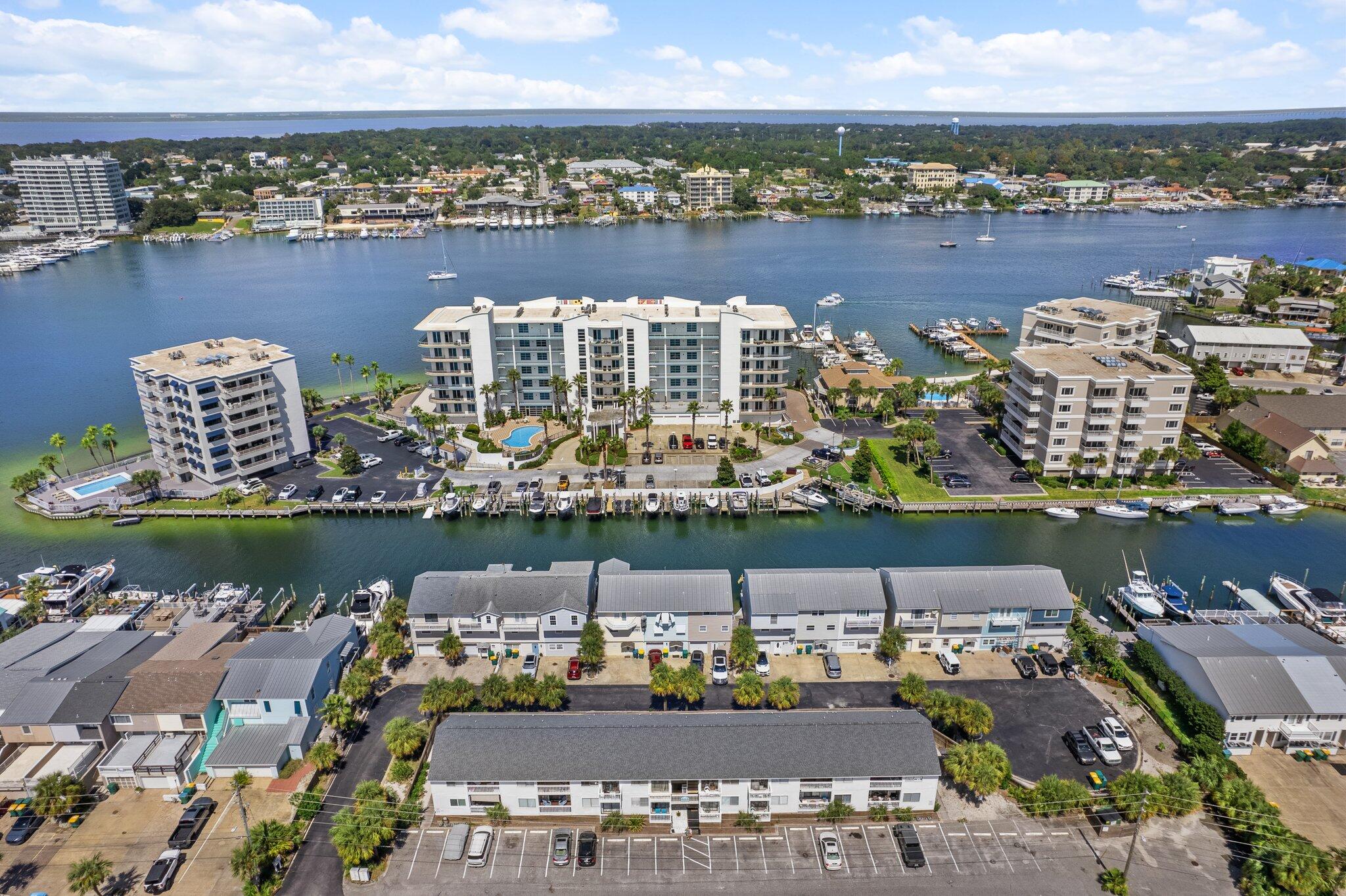 0.5 miles to Norreigo Point Beach! Sold fully furnished and rental-ready, this unit is ideal for a second home or short-term rental investment. Enjoy peace of mind with a new HVAC (2024), hot water heater (2023), and new windows and sliding glass doors (2022) already taken care of.

Additional highlights include:
** Updated bathroom with stylish finishes
** Hard surface flooring throughout for easy maintenance
** Low-density complex with only 16 total units
** Not a condotel - VA financing is available!

 Located in the heart of Holiday Isle, this charming turn-key studio is just 3 minutes from not one--but two deeded beach access points, Norriego Point, O'Steen Beach, and the East Pass with the iconic Destin Jetties. Whether you're soaking up the sun or exploring the water by kayak, paddleboard, or water taxi, this location puts you in the center of it all. 

Inside this 550 sq ft coastal retreat, you'll find a thoughtfully designed studio that maximizes every inch of space. A custom Murphy bed and pull-out sofa allow for flexible living arrangements without sacrificing comfort or style. The open-concept kitchen features a breakfast bar, stainless steel appliances, and everything you need to whip up a post-beach meal.

Location perks are unbeatable- bike, golf cart, or stroll to The Harborwalk, Big Kahuna's Water Park, Harbor Docks, Boshamp's, and The Boathouse Oyster Bar. Want to experience Crab Island or deep-sea fishing? You're just a short ride from the docks. Don't miss this rare opportunity to own your own beach property in Destin!