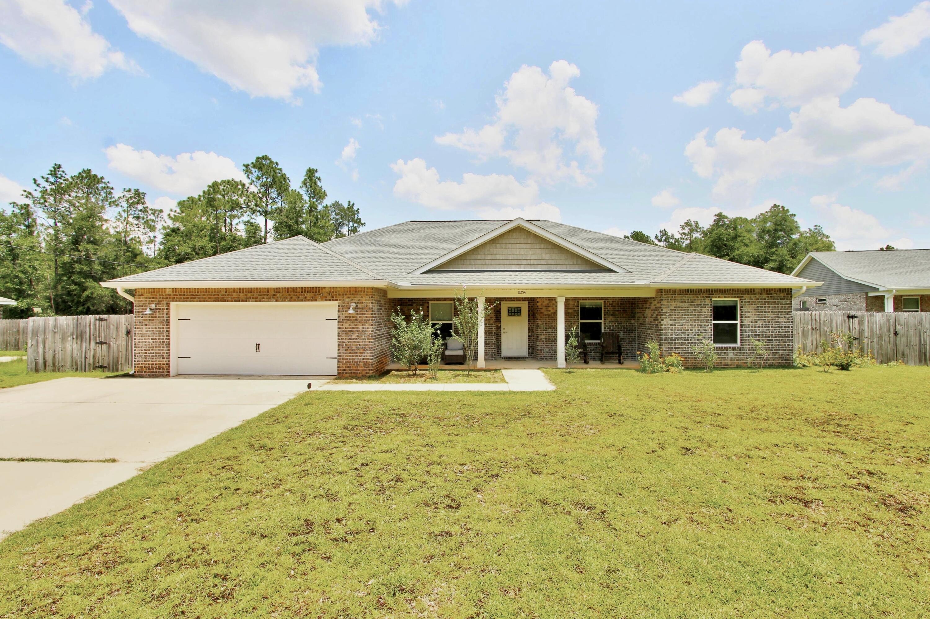 Welcome to your dream home! This beautiful all-brick home is perfectly situated on a spacious one-acre lot, offering the privacy and peaceful setting you've been looking for. Designed with both comfort and functionality in mind, this home features 4 bedrooms plus a dedicated office or media room, providing plenty of space for work, relaxation, or entertaining.

Step inside to find durable luxury vinyl plank flooring throughout the main living areas, with elegant porcelain tile in the bathrooms and laundry room. The beautifully appointed kitchen is the heart of the home, showcasing granite countertops, a stylish tile backsplash, stainless steel GE appliances, solid wood soft-close cabinetry, recessed lighting, and a large granite eat-in bar that's perfect for gathering with family and friends.

The spacious primary suite is a true retreat, complete with a tray ceiling, oversized walk-in closet, and a luxurious ensuite bath featuring a large tiled walk-in shower, separate garden tub, and double vanities.

Enjoy outdoor living year-round on the expansive covered back porch with double ceiling fans--ideal for grilling, entertaining, or simply relaxing while overlooking the large, fenced backyard. With quality craftsmanship, thoughtful upgrades, and plenty of room to spread out, this home offers the perfect blend of comfort, style, and privacy. Schedule your showing today--you won't be disappointed!