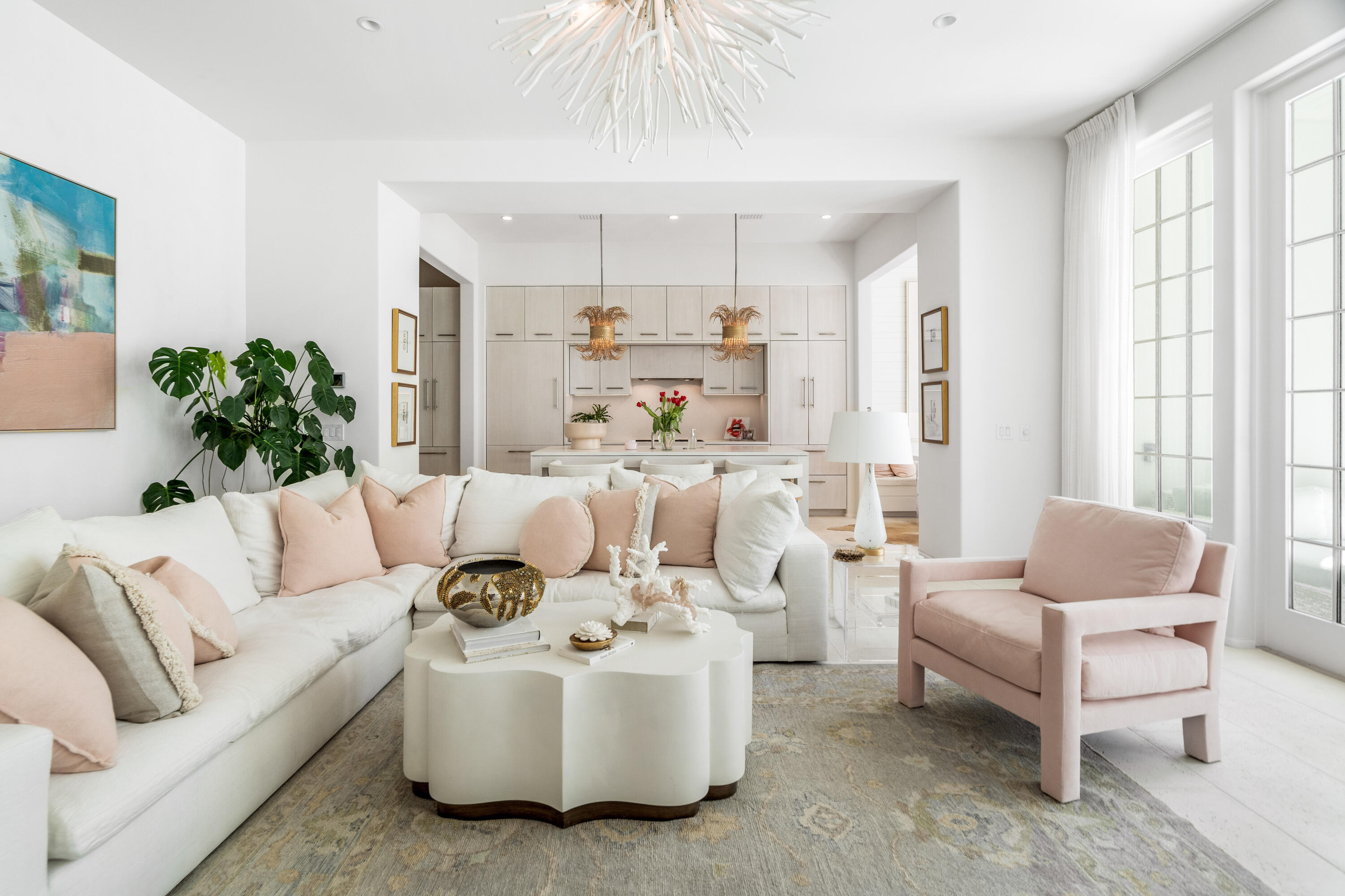 This stunning residence at Kaiya Beach Resort, designed by Khoury-Vogt Architects and Bella Beach Interiors, overlooks the heated pool with direct pool views. The main level features 11-foot ceilings, expansive living & dining spaces, large-format concrete flooring, & a chef's kitchen appointed with Sub-Zero and Wolf appliances, Caesarstone countertops, & custom cabinetry. Every detail reflects refined craftsmanship & understated elegance, from the Waterworks fixtures to the white oak flooring & marble throughout the upper level. The current owner further elevated the interiors with Venetian plaster walls, designer lighting, designer fabric on window treatments, custom bedding, and curated wallcoverings by Phillip Jeffries, Thibaut, and Osborne & Little, adding warmth, texture, and character. Upstairs, 3 spacious bedroom suites and three full marble bathrooms provide privacy & comfort, all finished with the same elevated aesthetic found throughout the residence. Nearly 900 sq ft of covered terraces extend the living space outdoors for poolside views & entertaining. There is an oversized 2 car garage. Mews owners/guests still have access to the private Mews pool, grill area, and beach access without joining the Beach Club. Optional Beach Club membership includes additional  gulf-front infinity pool, rooftop pool at the residences, concierge beach service. Coming soon: 5,000 sq foot spa/gym  and the Lamuse d'or cafe!