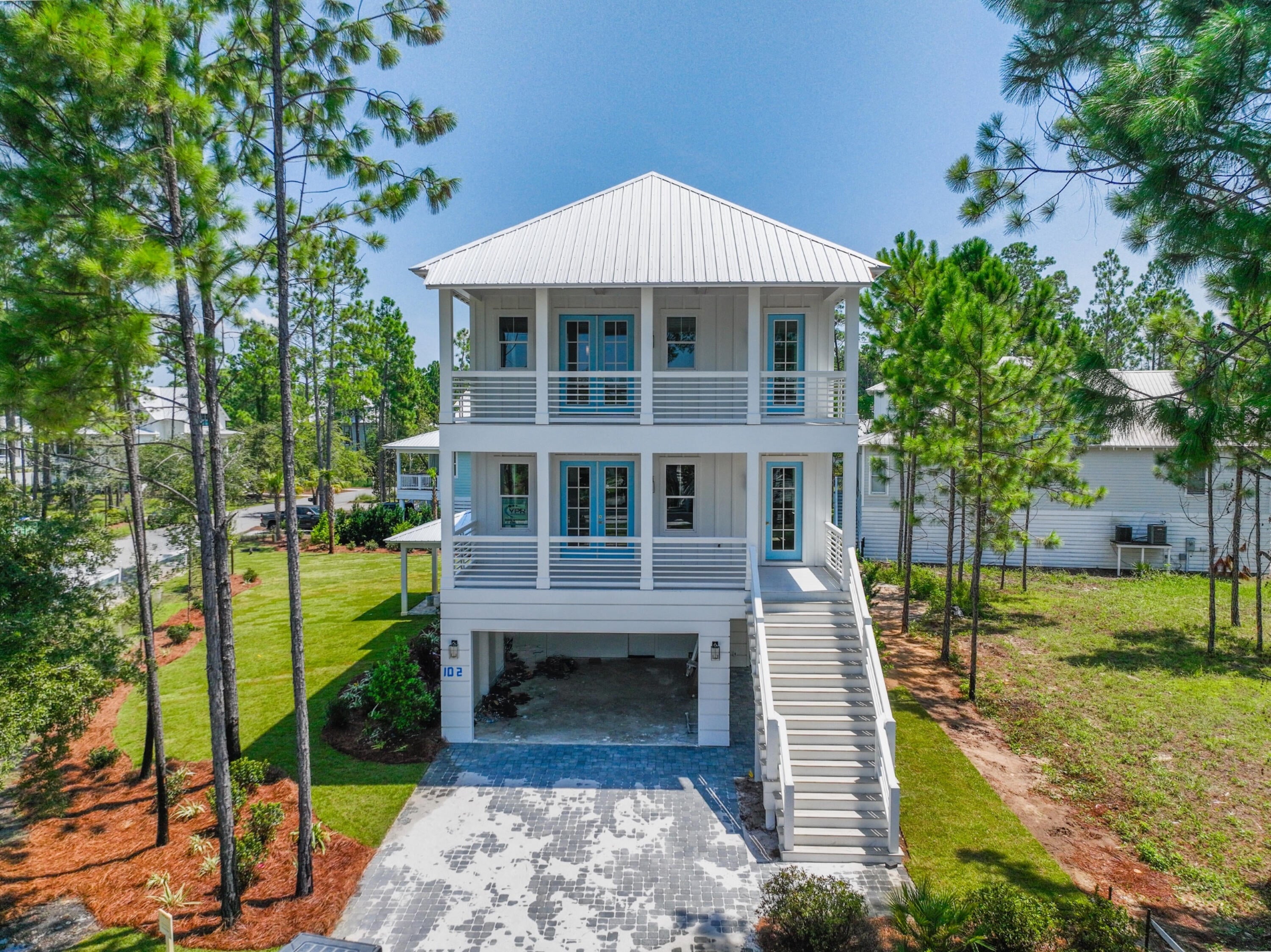 New construction in the gated bayfront community of Cessna Landing in Santa Rosa Beach. This thoughtfully designed coastal home features a spacious floor plan with a large driveway and garage area below.
The home offers a bright, open layout with abundant natural light and quality finishes throughout. Multiple covered porches on both levels provide ideal outdoor living space, perfect for enjoying the peaceful surroundings.
Cessna Landing is a private, gated community offering close proximity to the bay, with a nearby public boat ramp providing easy access to the water for boating and fishing. Conveniently located just a short drive to the beautiful beaches of the Emerald Coast.
A great opportunity for a primary residence, second home, or investment property in a desirable Santa Rosa Beach