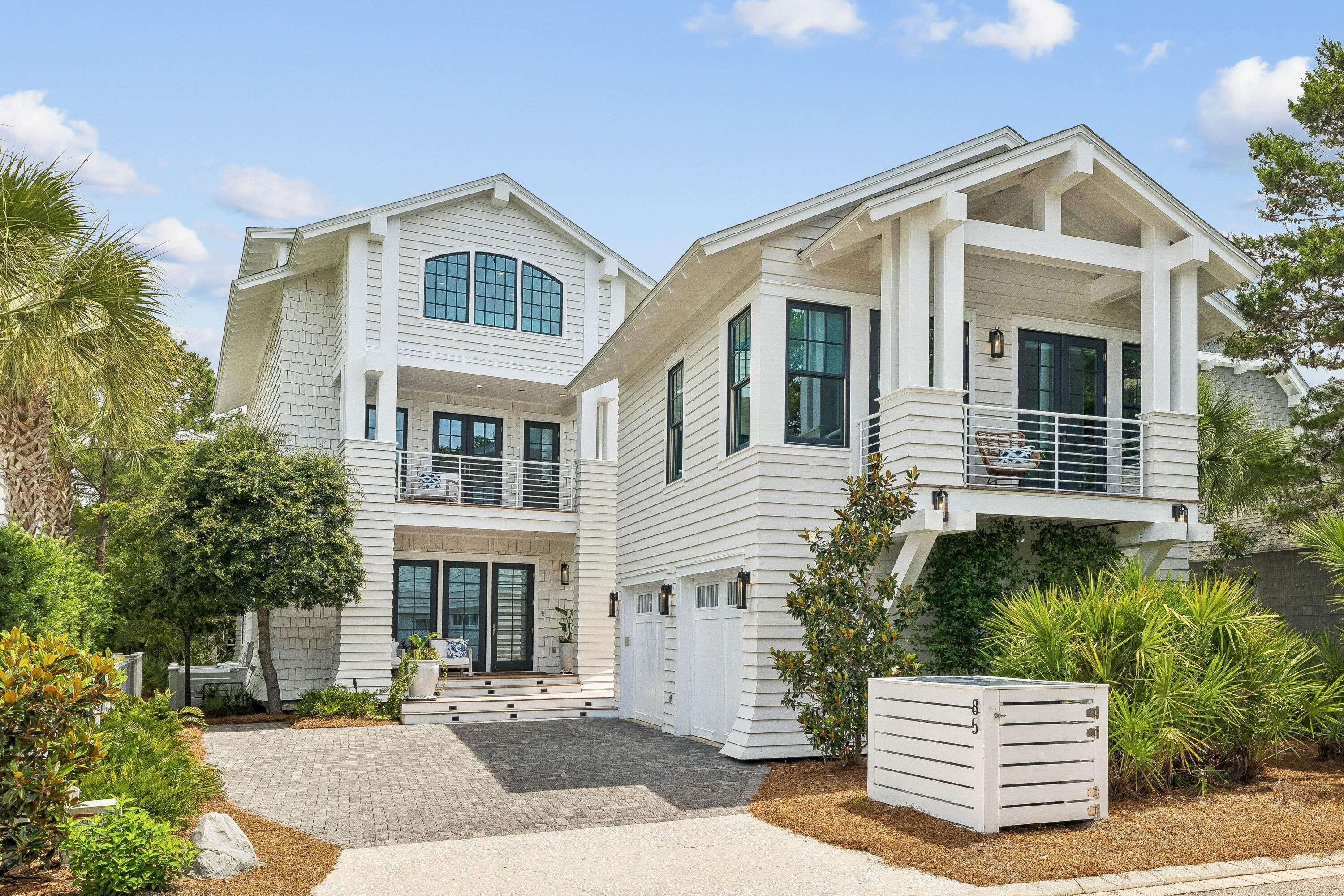 Experience unparalleled privacy and refined coastal living in this beautifully updated WaterSound Beach residence, offering a four-bedroom main home, a one-bedroom carriage house above a detached two-car garage, and a serene outdoor courtyard with a heated swimming pool. Perfectly positioned on a quiet cul-de-sac alongside a meandering creek, this home enjoys a rare sense of tranquility in the heart of the community. Thoughtfully enhanced with extensive recent upgrades, the interiors blend timeless design with elevated modern finishes. Light-filled living spaces welcome you with clean lines, custom draperies, and multiple sitting areas anchored by a gas fireplace.

The kitchen is both functional and striking, featuring quartz countertops, a dramatic counter-to-ceiling designer backsplash, and a full suite of Wolf and Sub-Zero appliances, now complemented by a new ice maker and thoughtfully curated designer hardware. A newly added custom built-in bar with backlit quartzite and under-counter lighting creates a sophisticated focal point for entertaining. Recent enhancements throughout the home include a new roof, new third-floor picture window, teak porch decking, designer lighting and wallpaper, updated plumbing fixtures, and custom California Closets--a highly sought-after upgrade that adds both luxury and functionality. Additional upgrades such as new built-in garage refrigeration, updated fireplaces with modern controls, and curated furnishings--including RH outdoor pieces and designer dining elements--further elevate the home's turnkey appeal. The primary living area opens to a cozy screened porch leading to a private courtyard oasis, complete with a heated pool, outdoor kitchen and grill, fireplace, and TV--all overlooking the serene creek, framed by mature trees that create a lush and private backdrop.

Two luxurious primary suites--one on each level--offer exceptional comfort and privacy. The first-floor suite features soaring ceilings, a spacious walk-in closet, and direct access to the pool, while the second-floor suite includes a fireplace and a generous covered porch overlooking the creek. Both offer spa-like bathrooms with dual vanities, soaking tubs, and walk-in showers. Upstairs, a guest suite with a private balcony and ensuite bath complements the third-floor retreat, which includes four custom built-in bunks, a full bath, a secondary living area, wet bar, and gulf views--an ideal space for guests or extended family. The carriage house provides additional flexibility with its own living area, bedroom, full kitchen, office nook, and private bath--perfect for guests or rental income.

Located within the gated WaterSound Beach community, south of Scenic Highway 30A, residents enjoy a rare blend of seclusion and access to world-class amenities, including resort-style pools, a fitness center, green spaces, and private boardwalks leading to one of the most pristine stretches of coastline along 30A. Whether as a full-time residence or an investment property, this meticulously upgraded home offers a rare opportunity to own a truly exceptional piece of WaterSound Beach.