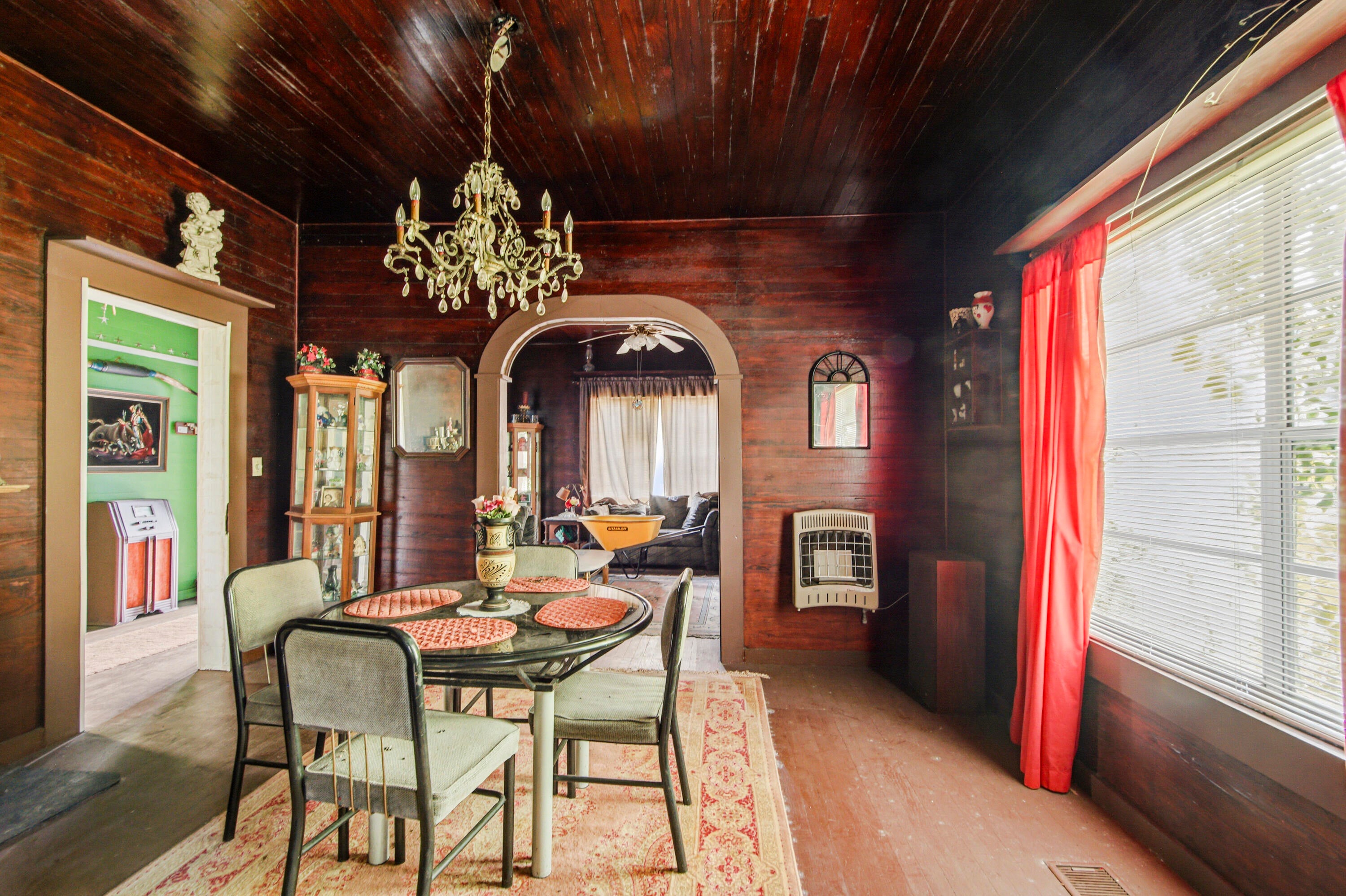 Whether you have a wild, artistic side - or you've always had the innate ability to see what a property COULD BE - this storybook 1939 cottage is a seriously cool project. But don't read ''project'' as dilapidated. No, no - this property actually feels incredibly solid. The tongue-and-groove is practically everywhere, and the arched door frames lend character you simply can't recreate. Located in downtown DeFuniak Springs, directly across from Harbeson Field - you even have an opportunity to use this as a commercial space with city approval. Currently zoned C-2 with Future Land Use as LDR, Low Density Residential (documents attached). The cottage is over 2300SF with spacious rooms - and the upstairs has the potential to be an amazing master suite, or simply where all the kids sleep and hang out. Is she covered in vines? She is. Is she also covered in possibilities? Absolutely she is. Don't dismiss this one if you're the creative type, an investor looking for a new flip, or the entrepreneur looking for a new location for your business. The city currently offers 50-50 matching grants through the CRA for both residential and commercial, from $15-30k for exterior improvements (defuniaksprings.net for details; conditions apply). Sharply priced to attract buyer attention. Cash or conventional financing only.