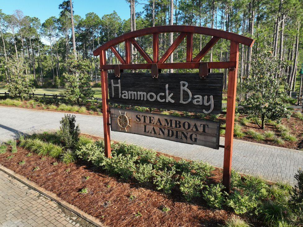 BUILD YOUR  DREAM HOME IN THE STUNNING WATERFRONT COMMUNITY OF STEAMBOAT LANDING! One of only 5 remaining Lots in Steamboat Landing. Craft Your Slice of Paradise on this Exquisite Wooded Lot. Take leisurely strolls along the boardwalk leading to the fully-built Bayfront clubhouse, now open and available for all residents to enjoy. Savor breathtaking sunsets and bask in the beauty of Choctawhatchee Bay from the 500 ft dock--an experience that's right at your doorstep.