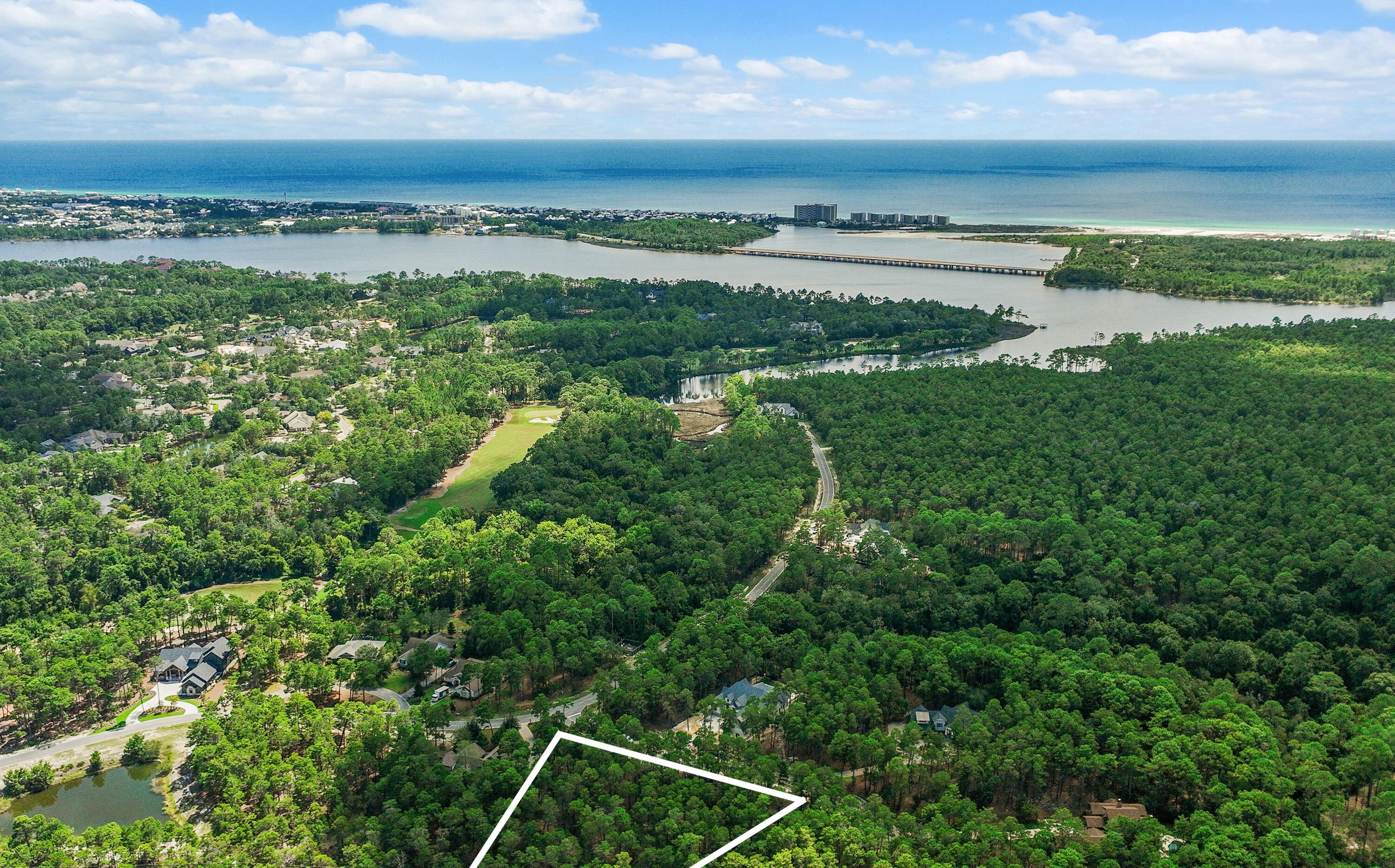 A Rare Homesite. A Remarkable Coastal Lifestyle. 
Discover this exceptional .68-acre premier B Lot in the gated community of Wild Heron and start imagining what's possible. With 131 feet of frontage, this private, wooded homesite is high, flat and dry and located in an X flood zone, offering favorable building conditions with little, if any, fill potentially needed--an advantage that can help reduce site-preparation and building costs. There is ample room for a spacious one-level home with side-entry garage and circular drive, all positioned on a quiet side street backing to protected green space. No build-time requirement allows you to design and build at your own pace.

Wild Heron continues to attract attention from those who appreciate the coastal lifestyle of 30A, but desire more space, privacy, and value. Just minutes from 30A, Rosemary Beach and Alys Beach, the community offers a more relaxed setting with thoughtfully planned homesites and quality custom-construction standards--without the 30A price premium.

Centered around Lake Powell, the largest coastal dune lake in the country, Wild Heron offers an exceptional collection of amenities. Residents enjoy a lakeside pool and hot tub, lakefront fitness center, fire pit, playground, 24 miles of walking and biking trails, and a private lakefront boathouse and pavilion with fireplace and generous storage for kayaks and other water toys. Launch from the lake for a paddle toward the Gulf's white-sand beaches or Camp Helen State Park. Community gatherings, concerts and movie nights on the green add to the welcoming neighborhood atmosphere, with pet stations throughout the community.

Golf, tennis and clubhouse privileges are available through WaterSound membership.

Envision you and your family in this private coastal retreat, whether is a second home or year-round residence. This is an opportunity to create something truly personal in one of Panama City Beach's most distinctive communities--where space, privacy, nature and proximity to the Gulf come together.
Measurements are approximate. Buyer should verify all data and dimensions.