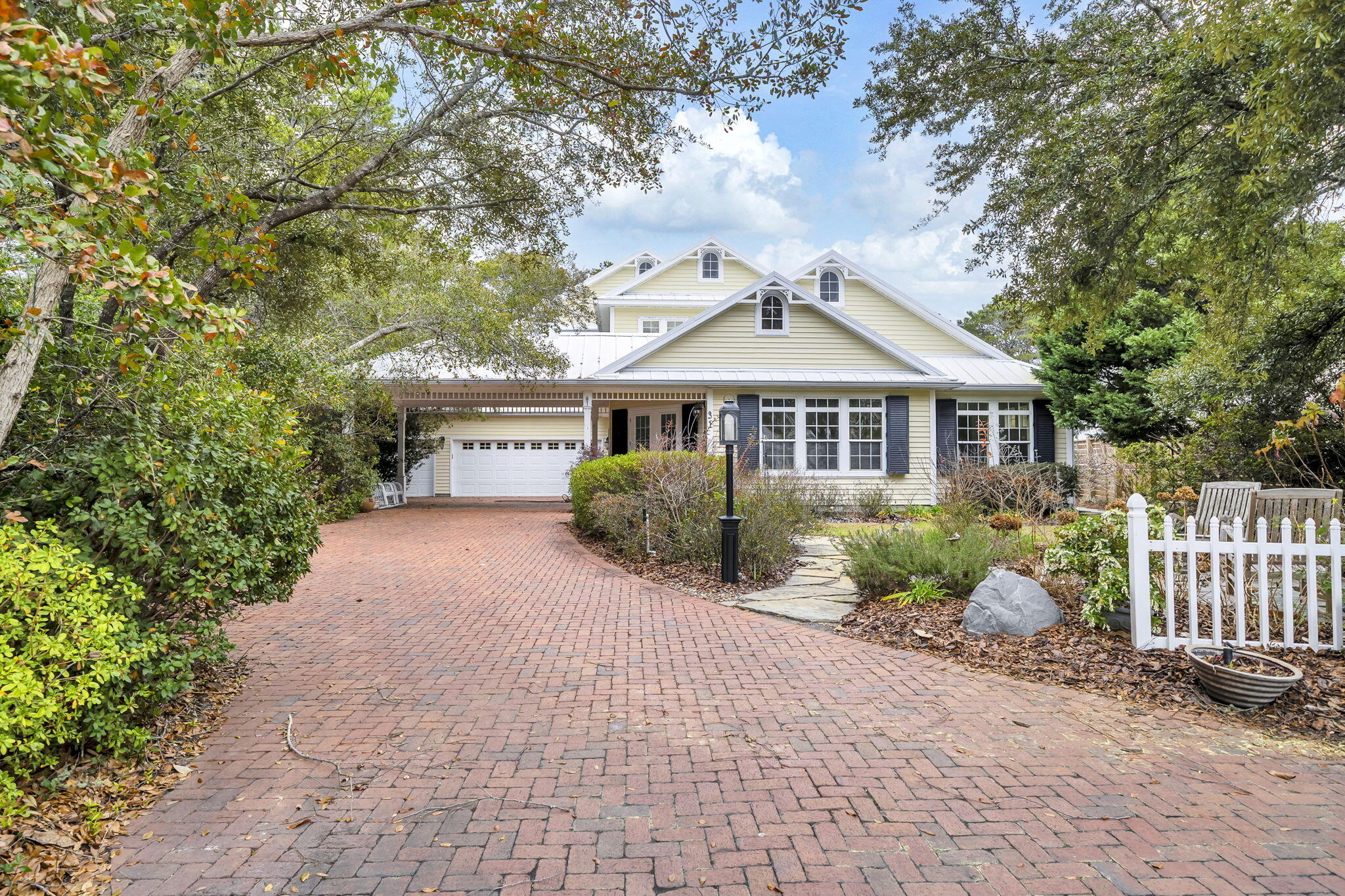 UNDER CONTRACT - ACCEPTING BACK UP OFFERS.  Experience coastal living at its finest in this beautifully crafted custom home, situated in an established neighborhood with private beach access and access to Camp Creek Lake.

The first floor features an open-concept design with vaulted ceilings and abundant natural light, creating a bright and inviting atmosphere. Inside, you'll find custom-built details throughout, including hardwood floors, custom cabinetry, and freshly painted interiors.

Each bedroom includes its own ensuite bathroom, offering comfort and privacy for family and guests alike.

Step outside to your private oasis - an inground pool enclosed by a two-story lanai, complete with an outdoor kitchen for entertaining or enjoying a peaceful evening.