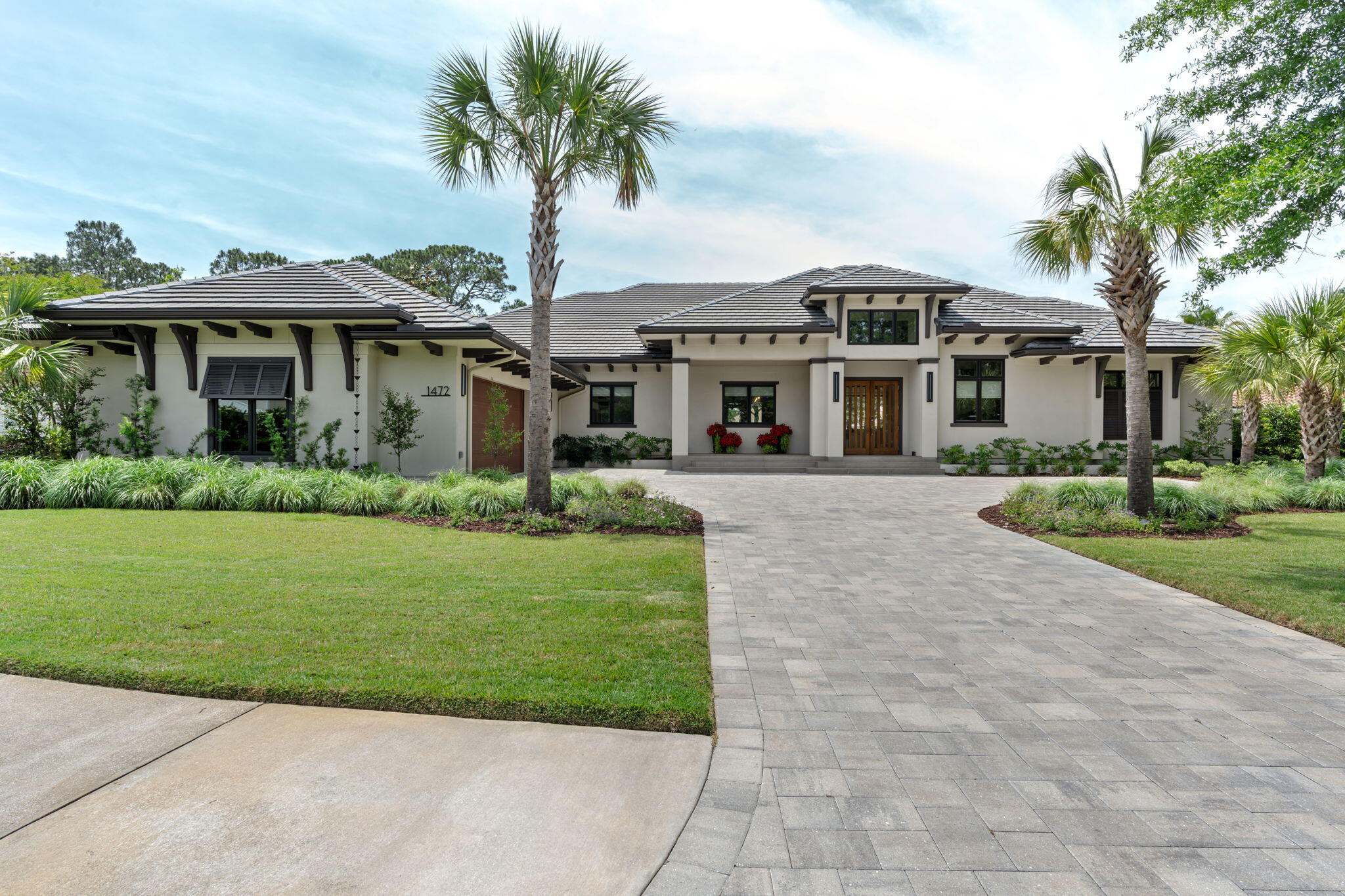 Welcome to one of Sandestin Golf & Beach Resort's premier custom homes, positioned on the Raven Golf Course with spectacular sunset views, exceptional privacy, and luxury finishes throughout. Built on an elevated ''High & Dry'' homesite approximately 3-4 feet above surrounding properties, this meticulously constructed residence offers superior craftsmanship and timeless design.
The open floor plan is designed for effortless indoor-outdoor living with expansive accordion glass doors leading to a resort-style outdoor oasis featuring an oversized pool, spa for up to 10, fully equipped outdoor kitchen, three remote-controlled screened living areas, Sonos surround sound, and two porcelain-tiled decks overlooking the golf course.
Inside, you'll find engineered hardwood flooring, custom Marquis cabinetry, a chef's kitchen with an oversized island, premium appliances, oversized wine refrigerator, spacious utility room, motorized window shades, upgraded designer lighting with dimmers, fireplace, built-in closet cabinetry, and a luxurious primary suite with a bidet. Additional features include an insulated oversized 2.5 car garage (24' x 34') with epoxy flooring, standing-room attic storage, two additional storage rooms totaling 18' X 3.5', stand by generator, hose bibs at all four corners, and a custom front door. The professionally designed landscaping enhances the home's exceptional curb appeal, while integrally colored stucco eliminates the need for exterior painting for decades.
Engineered for long-term durability, the home includes a rubberized exterior moisture barrier, reinforced structural construction with threaded rebar, and 36-inch roof overhangs for enhanced weather protection. Ideally situated near the 16th tee of the Raven Golf Course, the home enjoys panoramic golf course views without concern of golf balls striking the property.
Built for luxury, comfort, and entertaining, this extraordinary residence offers a rare opportunity to own one of the finest homes in Sandestin.