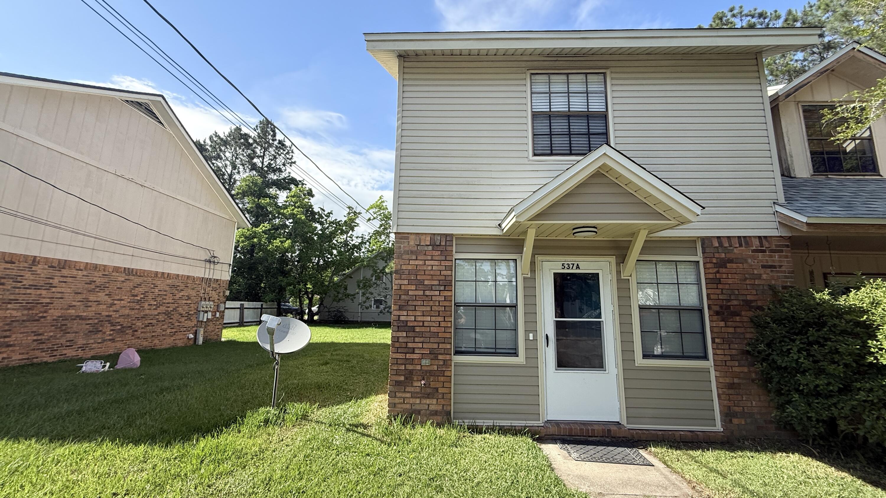 Clean and Ready now. Stainless Refrigerator & Double Oven Range !  2 BR 1.5 BA End-Unit Town Home in FWB with 4 parking spaces, a small yard & lots of storage!  Large Living room- inside laundry.  Conveniently located close to Hurlburt Field, Eglin AFB and 7th Special Forces! There are 3 comfortable (or 4 tight) Parking Spaces and a storage shed! There are three linen closets; storage under the stairs; a separate Storage shed in the back yard & an indoor laundry w/washer/dryer. Downstairs, there is a Living Room, Dining Area, Kitchen, Laundry & half bath for guests. There is wood laminate flooring downstairs in Living room & Fresh paint and Carpet upstairs. The Living Room is large and open with lots of wall space and natural light! Kitchen/Dining Area has wood cabinets & lots of counter space! Upstairs, there are two Large Bedrooms (11x13 &12x13 + Full Bath. Minimum FICO credit score of 680 and we ask that each applicant make approx. 2.5 times the monthly rent. We will make some exceptions on income with stellar credit. A small pet under 40lbs may be considered with recent references and deposit. Will consider a small pet (non dangerous breeds.)