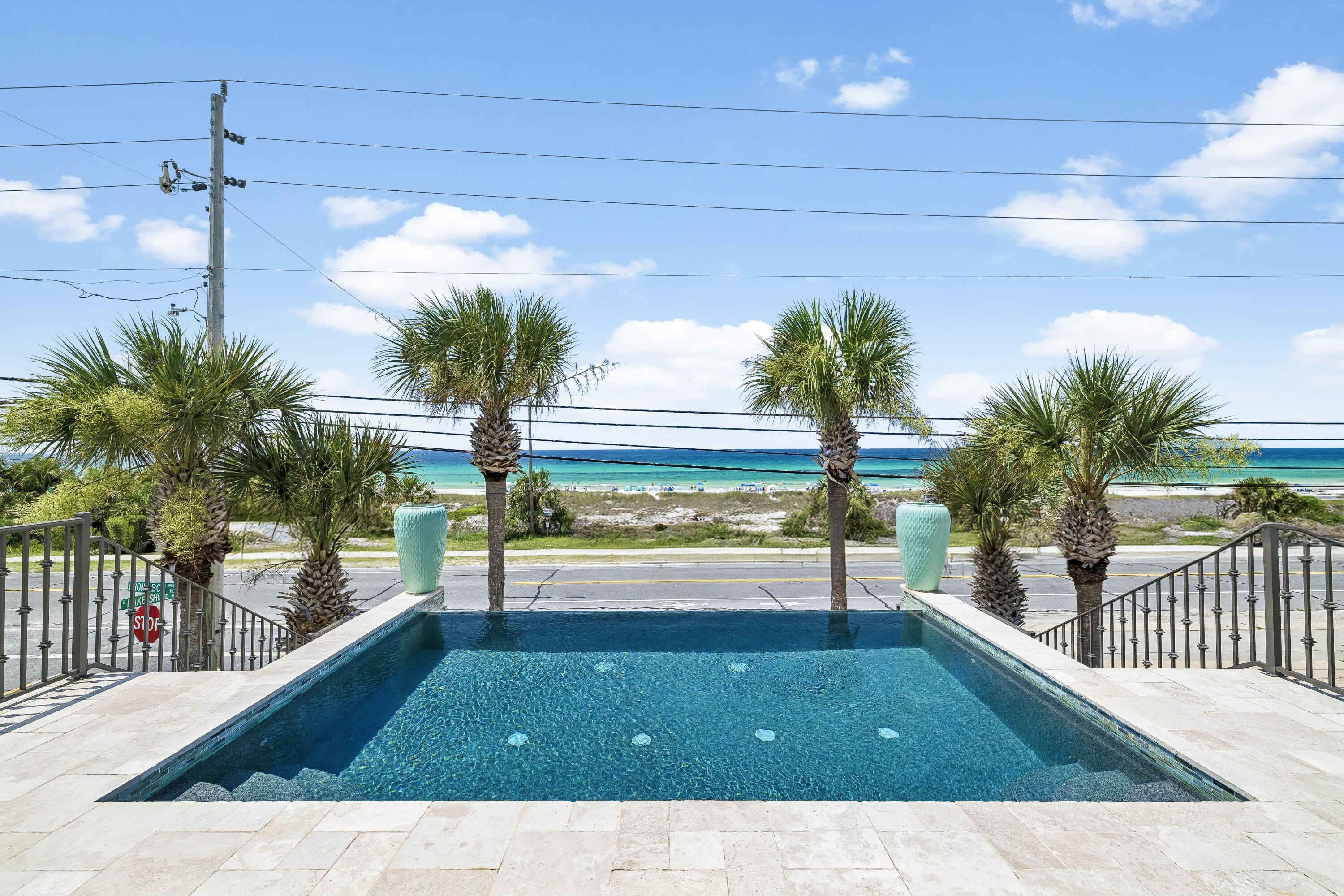 Elevate your coastal lifestyle in this one-of-a-kind, 4,000+ square-foot beach home, ideally positioned directly across from the protected dunes of Laguna Beach. A rare offering in one of the area's most desirable locations, this exceptional property offers unobstructed Gulf views and convenient beach access, creating the perfect setting for unforgettable family gatherings and everyday coastal living.
Designed for effortless entertaining, the home features a stunning exposed brick kitchen that flows seamlessly into an expansive living area with soaring 12-foot reclaimed wood ceilings, blending warmth, character, and sophisticated coastal style.
Enjoy breathtaking Gulf views from multiple levels, including the private top-floor primary suite, where spectacular sunrises and sunsets become part of your daily routine. The home offers five luxurious bedroom suites, each thoughtfully appointed with a king-size bed with en suites, providing comfort and privacy for family and guests alike.
Step outside to your private second-floor heated infinity pool overlooking the Gulf, or take advantage of the commercial elevator providing convenient access to every level. Additional highlights include a spacious three-car garage and the convenience of being offered fully furnished and turnkey, ready for immediate enjoyment or investment.
Blending timeless coastal elegance with exceptional amenities, this extraordinary retreat offers luxury living just steps from the sugar-white sands and emerald waters of the Gulf.