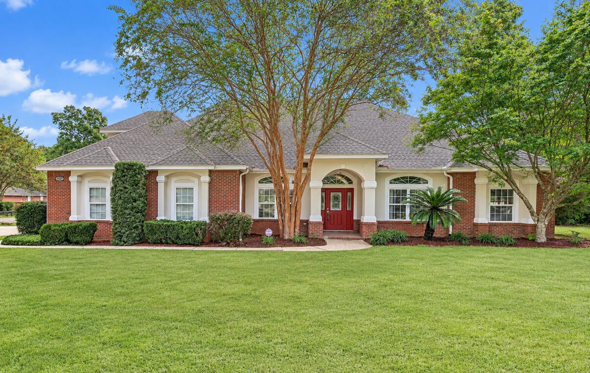 SELLER WILL CONTRIBUTE UP TO $10,000 TOWARD BUYER'S CLOSING COSTS!! Meticulously custom-built 4-bedroom, 3-full-bath brick home showcasing exceptional craftsmanship and an impressive array of upgrades throughout. Soaring 10-foot ceilings, genuine hardwood floors, porcelain tile in all common areas and elegant fixtures create a timeless, sophisticated feel. The spacious interior offers plenty of room for entertaining, featuring a large dining room, living room, family room, and an upstairs bonus room. The centrally located kitchen is designed for both function and style, with granite countertops, custom cherry cabinetry, under-cabinet lighting, wall-mounted oven, glass-top range, illuminated pantry and convenient pull-out cabinet drawers for enhanced storage. The expansive primary suite features a trey ceiling and a luxurious en-suite bath. Enjoy dual walk-in closets with custom wood built-ins, dual granite-topped vanities, a custom-tiled walk-in shower, heat lamps, and a relaxing soaking tub. Custom architectural details, upgraded trim, built-ins, central vacuum, and surround sound add to the home's exceptional level of finish. The irrigation system conveys as-is. A truly distinctive home with thoughtful upgrades and quality craftsmanship throughout. Enjoy wonderful community amenities including swimming pool and park!! Buyer to verify all information.