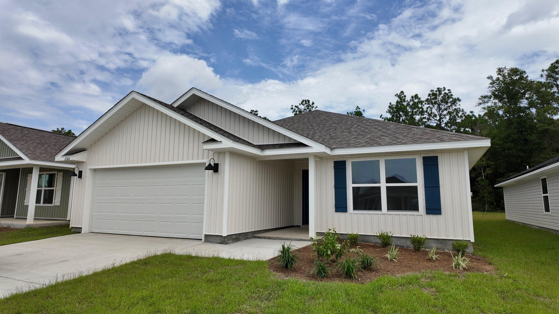 Welcome to Rivers Cove featuring a beautiful community pool and playground. The charming Lismore model offers a fabulous open layout for relaxed living, 3 bedrooms, 2 bathrooms, 2-car garage, and the 'Smart Home Connect' System with various convenient Smart Home devices. The well-designed open kitchen includes stainless steel appliances, a smooth-top range, built-in microwave, quiet dishwasher, corner pantry, island bar, eye-catching wood-look flooring, and plush carpet in the bedrooms. No wasted space and a highly desirable floorplan. Fabric Hurricane door and window protection is also included. Enjoy the stylish curb appeal in the rapidly growing area. ALL LISTING pictures, colors, features, and size may vary. Square footages are approximate.