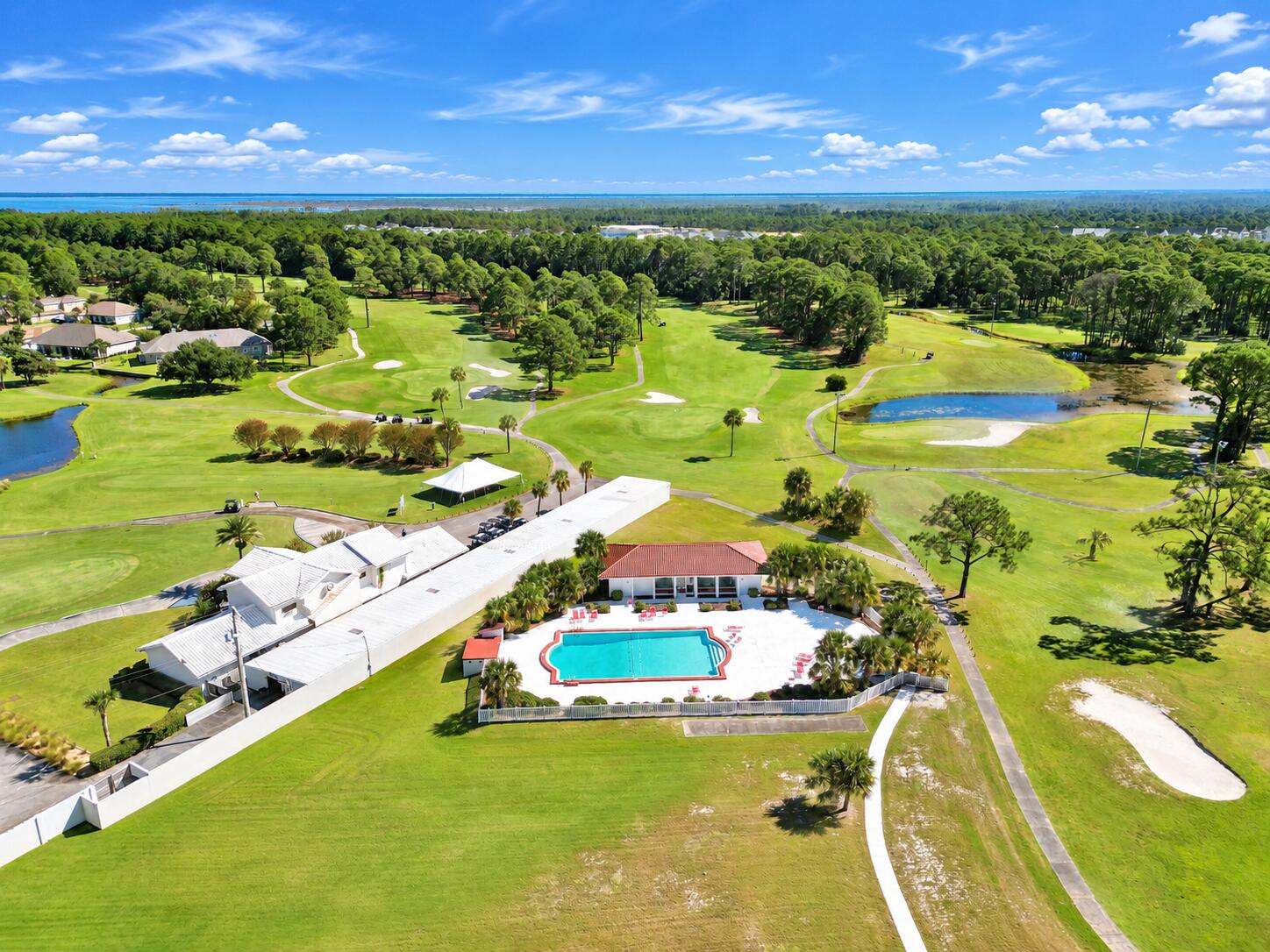 Welcome to 112 Fairway Blvd, Unit 404, a charming 2-bedroom, 1-bath condo located in the desirable Colony Club community of Panama City Beach. Perfectly positioned along the golf course, this spacious unit features an enclosed patio overlooking the community pool and greens, creating a relaxing spot to enjoy the peaceful surroundings and beautiful views. Inside, you'll find an open living area filled with natural light, a functional kitchen, and generously sized bedrooms. Whether you're looking for a full-time residence or a Florida vacation retreat, this condo offers an easy, low-maintenance lifestyle in a convenient location. Colony Club features beautifully maintained grounds, a sparkling inground community pool, and a community room located beside the pool--an ideal space for private gatherings. Enjoy walking trails and a quiet residential setting while still being close to everything Panama City Beach has to offer. Located next to Holiday Golf Club, approximately four minutes from the beach and just two miles from Pier Park, you'll have shopping, dining, entertainment, golf, and the beautiful beaches of the Emerald Coast all within easy reach. HOA dues are approximately $450 per month and include Wi-Fi, basic cable, water, sewer, trash, building insurance, community management, pool, and community room. Come experience the convenience, views, and relaxed coastal lifestyle offered at Colony Club!