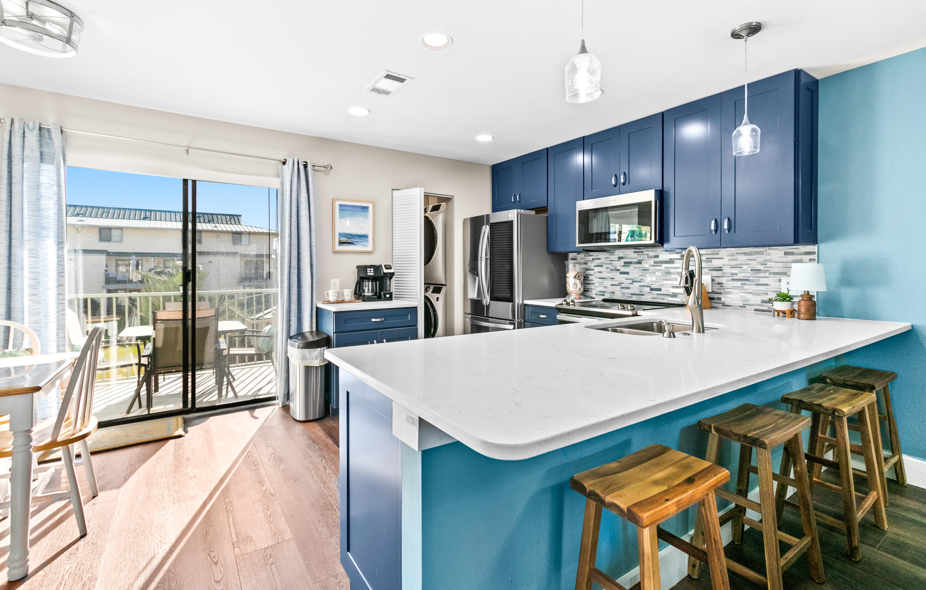Charming, updated 2-bedroom condo in the heart of Miramar Beach, located in the low-density Sandprints community just blocks from the sugar-white sands and emerald waters of the Gulf. Enjoy Gulf views from the entry and the private balcony off the primary suite. Offered turn-key and beautifully updated, this condo features new laminate flooring throughout, Quartz countertops in the kitchen and bathrooms, stainless steel appliances, updated lighting, coastal-inspired tile backsplash, new cabinetry, and a stylish coffee bar.

The spacious primary suite offers a king bed, ensuite bath, and direct balcony access--perfect for enjoying morning coffee with Gulf views. A guest bedroom, full guest bath, and full-size washer and dryer are conveniently located on the upper level. The open-concept layout is ideal for entertaining, featuring a dining area, breakfast bar, and additional dining nook near the main-level balcony overlooking the green space.

Sandprints offers a community pool & sundeck for relaxing after a day at the beach. Conveniently located near public beach access, Pompano Joe's, snorkeling reefs, and popular nearby destinations including Camille's at Crystal Beach, Silver Sands Premium Outlets & Destin Commons. Enjoy easy access to the pedestrian and bike path along Scenic 98, perfect for embracing an active coastal lifestyle. An exceptional value for the area with strong potential as a vacation rental, investment property, or second home - don't miss this opportunity!