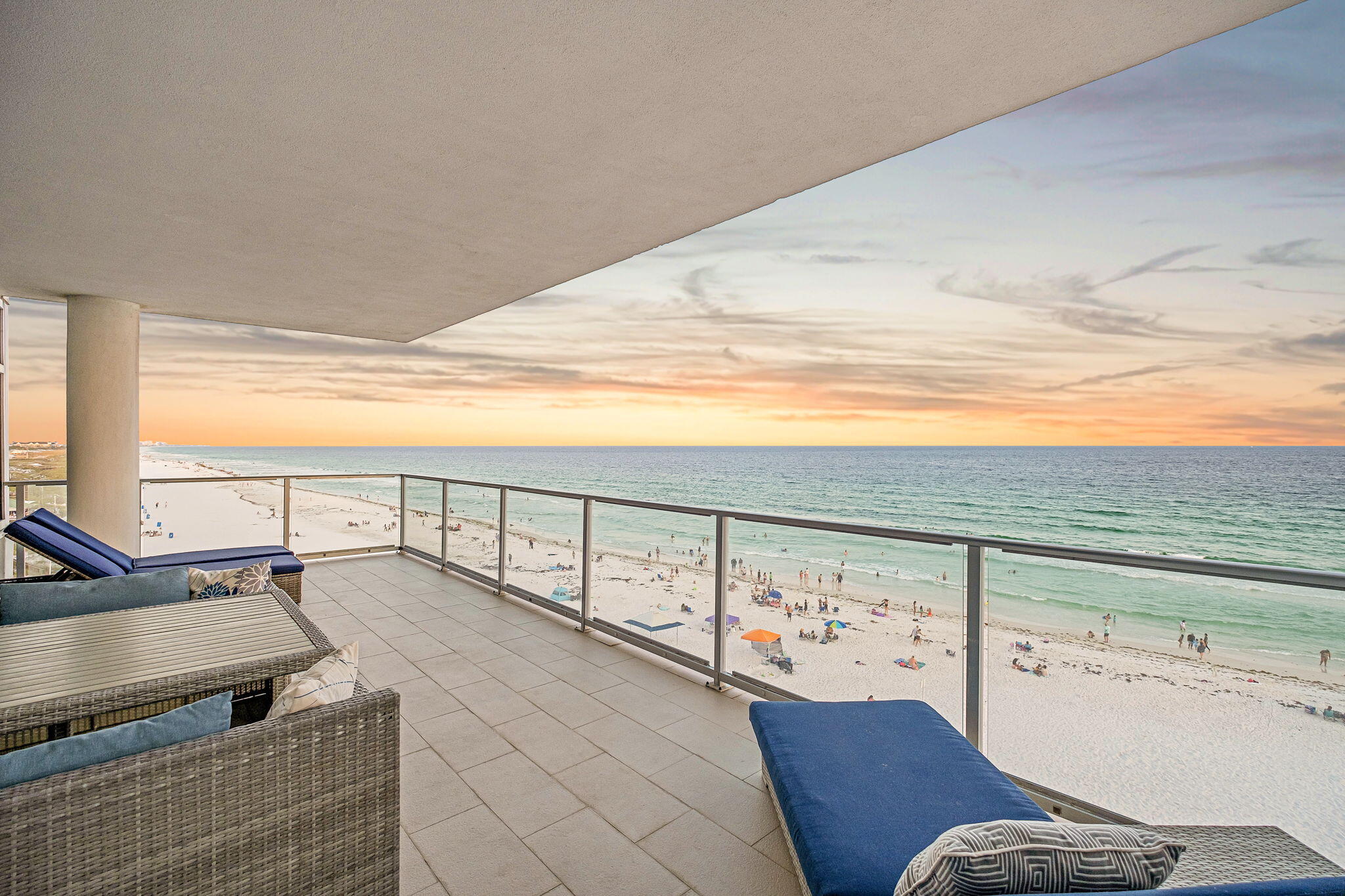 Experience elevated Gulf-front living at 1900 Ninety Eight, Destin's premier luxury high-rise perfectly positioned in the heart of the Emerald Coast. Ideally situated on the coveted southeast corner of the building, this three bedroom, three bath residence with a versatile flex space enjoys exceptional natural light and panoramic views stretching across the Gulf and eastward for miles down the coastline, overlooking beautiful Henderson Beach State Park. With only sixteen residences, private beach access, and an exceptional collection of luxury amenities, 1900 Ninety Eight offers an elevated ownership experience just moments from Destin's premier shopping, dining, and entertainment. Thoughtfully designed with a sophisticated coastal palette and upscale finishes, the residence offers a luxurious yet relaxed atmosphere that perfectly complements its spectacular setting.
Walls of glass along the south and east sides of the great room flood the interior with natural light while framing breathtaking water views from nearly every angle. The open-concept living spaces seamlessly connect to an expansive Gulf-front balcony featuring glass railing panels that maximize the unobstructed vistas and create the perfect setting for entertaining or simply enjoying the beauty of the coast. Complete with an electric grill and ample room for both dining and lounging, this expansive outdoor living space serves as a natural extension of the interior while providing a front-row seat to Destin's emerald waters and sugar-white beaches. The kitchen is thoughtfully positioned to overlook the great room and Gulf beyond, allowing the views to remain the focal point of everyday living. Designed with both beauty and functionality in mind, the space showcases luxury Thermador appliances, elegant marble and quartz countertops, custom cabinetry, and porcelain stone tile flooring that carries throughout the main living areas. The southeast corner location further enhances the experience with additional windows and sweeping shoreline panoramas that are rarely found.
Occupying the southwest corner of the residence, the primary suite serves as a true retreat, where a wall of windows and direct balcony access showcase the stunning Gulf backdrop. The spa-inspired bath is thoughtfully designed to take full advantage of the framed opening to the bedroom, allowing the breathtaking beach and Gulf views to remain part of the experience even while relaxing in the luxurious soaking tub. A sprawling custom vanity featuring specialty drawer storage and a large custom tiled shower complete the space, creating an atmosphere that is both elegant and serene.
Separated from the primary suite by the residence's thoughtful split floor plan, two spacious and beautifully appointed guest suites are filled with natural light and designed to provide an inviting retreat for family and friends. A versatile flex space, currently configured as a bunk room, offers additional accommodations while easily lending itself to a home office or media room. Bright and thoughtfully designed, this wing of the residence provides exceptional flexibility and privacy without compromising comfort or style.
Adding to the appeal is a private garage-style storage space with direct access from both the residence and the interior hallway, providing exceptional convenience rarely found in condominium living. Complementing the thoughtful design is an expansive laundry room with wet-room appointments and generous storage space, creating the perfect place to organize beach gear, golf clubs, and everyday essentials while enhancing the ease of coastal living.
Residents of 1900 Ninety Eight enjoy an unmatched collection of amenities including a rooftop pool and spa with sweeping Gulf views, a state-of-the-art fitness center, elegant lobby spaces, gated entry, and covered parking. Ideally located in the heart of Destin, this exceptional residence places owners just moments from Henderson Beach State Park, Destin Commons, and many of the area's most popular dining, shopping, and entertainment options. Offering the perfect blend of luxury, convenience, and coastal lifestyle, 1900 Ninety Eight delivers an elevated ownership experience in one of Destin's most desirable locations.
