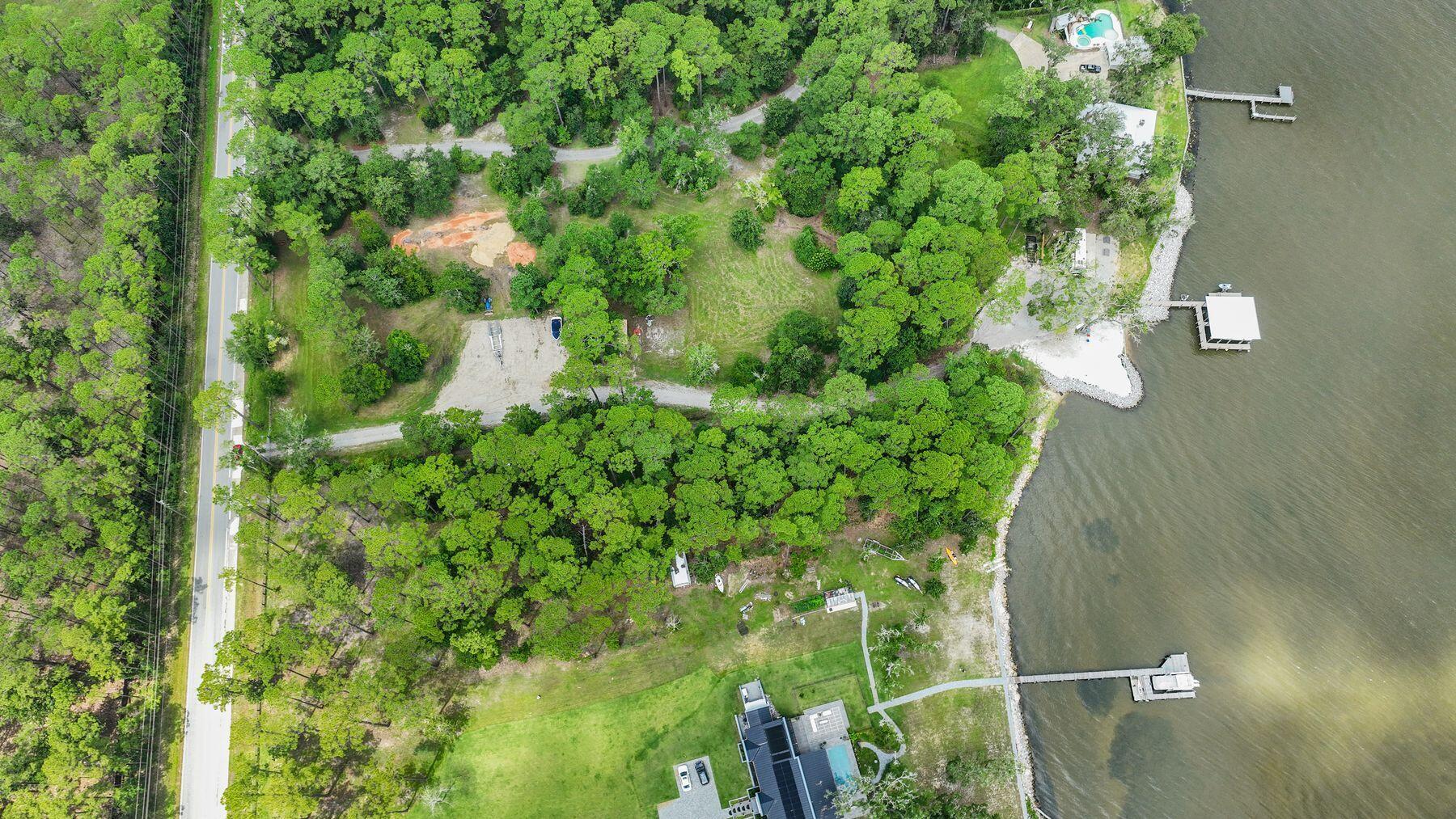 ±2 Acres · ±175 feet of Choctawhatchee Bay frontage · No HOA · Minutes to 30A

This two-acre, tree-lined property along Chat Holly Road offers approximately 150 feet on Choctawhatchee Bay--one of the most scenic and storied waterways on Florida's Emerald Coast. 

The Bay is prized for its quiet beauty, clear shallows, and endless ways to explore: launch a boat or paddleboard, fish the bayous, or cruise toward Crab Island and Destin's harborfront dining. 

The lot's generous depth provides room for an estate home, guest house, pool, or even a private pickleball court or collector-car garage, all surrounded by native oaks and pines for natural privacy. From here, you're minutes to Hwy 98, Grayton Beach, and 30A, as well as Dune Lakes Recreational Park and the area's top-rated schools.