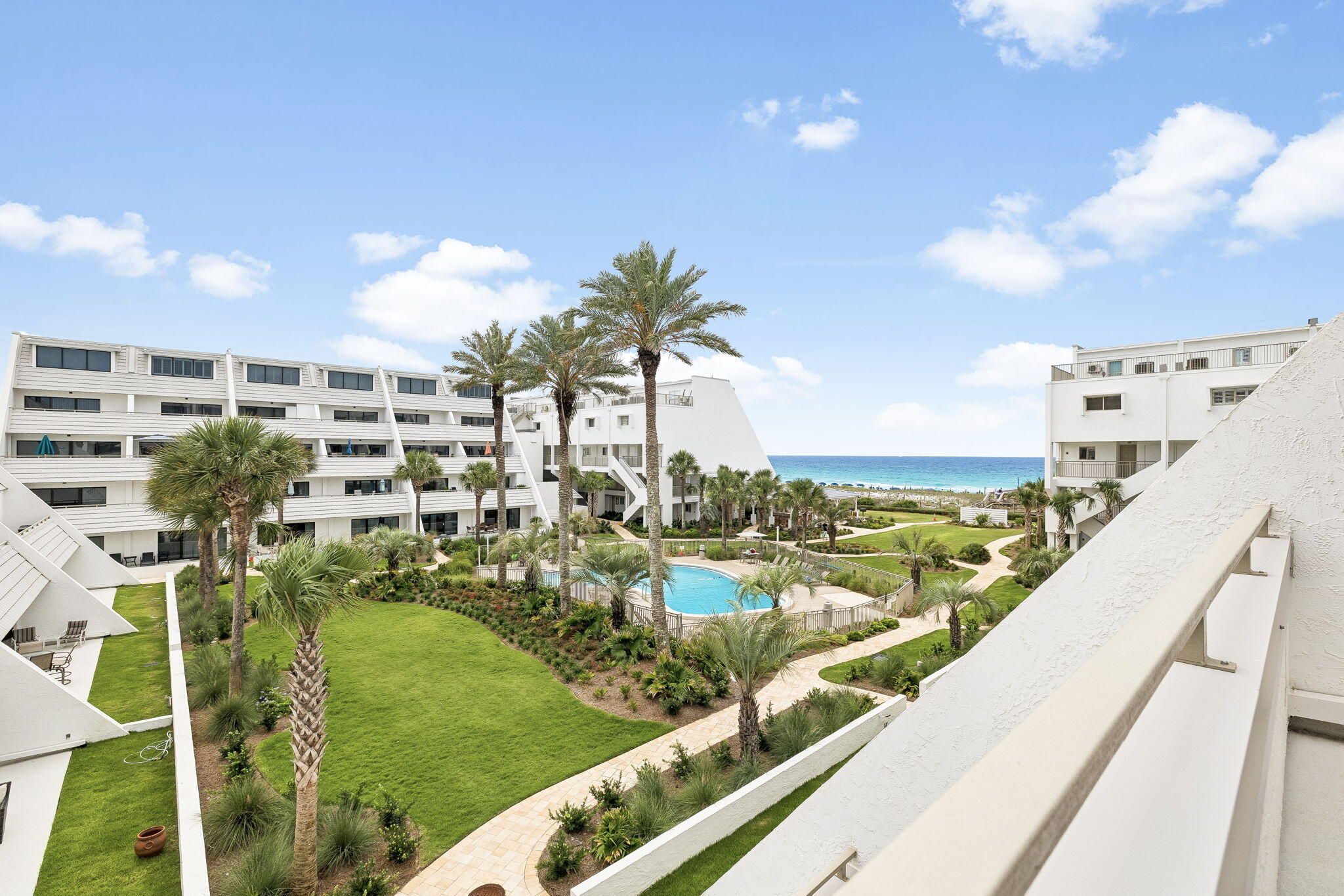 Experience exceptional beachfront living from this beautifully positioned three-story residence located directly on the Gulf in the highly sought-after Aegean community. Thoughtfully designed with 3 bedrooms, 3.5 baths, and a unique floor plan rarely found along the Emerald Coast, this spacious residence captures southeast views overlooking the resort-style pool deck and lush landscaping, sugar white beaches, and the emerald waters of the Gulf beyond. Offered fully furnished (with minimal exceptions), this condo presents an outstanding opportunity as a primary residence, second home, or vacation rental investment, combining an exceptional floor plan, sparkling Gulf views, and an unbeatable beachfront location. Adding to the appeal, Aegean has already completed extensive exterior renovations and required building improvements with over $200,000 in assessments having been paid in full, offering valuable peace of mind and allowing the next owner to enjoy the benefits of these enhancements without the burden of those costs.
Designed for gathering and effortless coastal living, the main level features an open living, dining, and kitchen area framed by expansive sliding glass doors that highlight the picturesque coastal setting. The spacious layout flows seamlessly to a private balcony, creating the perfect setting for morning coffee, outdoor dining, or simply unwinding while taking in the ever-changing colors of the Gulf and the gentle sounds of the waves below. A convenient half bath adds functionality for guests, while tile flooring throughout the living areas provides easy maintenance for beachside living. The kitchen offers stainless steel LG appliances, a premium Miele dishwasher, ample cabinetry, and a distinctive custom green tile backsplash that adds a touch of personality and coastal charm.
The second level is thoughtfully designed to provide comfort and privacy, featuring two generously sized bedrooms, each with its own en suite bath. The primary suite enjoys access to a private balcony where gentle Gulf breezes and pleasant views of the beach and emerald waters create a relaxing setting to begin and end the day. A conveniently located laundry area with a full-size washer and dryer, along with wire shelving for additional storage, adds everyday functionality and convenience to this level.
Occupying the entire third floor, a loft-style bedroom with its own full bath is currently configured as a bunk room, providing a versatile space ideal for accommodating additional guests, creating a media room, or establishing a private retreat. Comfortable carpeting throughout the bedrooms enhances the inviting atmosphere and creates a warm contrast to the tile flooring found in the main living spaces.
Residents of Aegean enjoy an exceptional collection of amenities including a Gulf-front swimming pool, BBQ grilling area and gazebo, tennis courts, gated entry, and an expansive stretch of white-sand beach. Owners also benefit from access to convenient on-site beach service available at preferred owner rates. Ideally located in the heart of Destin on Holiday Isle, the community offers convenient access to dining, shopping, entertainment, and everything that makes the Emerald Coast one of the most sought-after destinations in Florida.