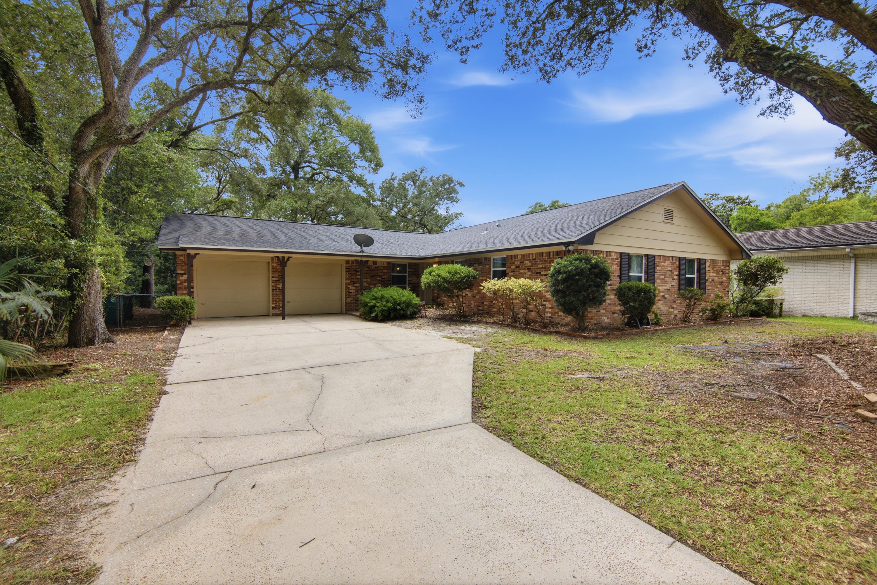 Thoroughly reimagined from the inside out, this property blends classic charm with comprehensive modern upgrades. Located just 5.6 miles from Eglin AFB and 7.4 miles from Hurlburt Field. Every major system and finish has been expertly updated, offering complete peace of mind and an inviting, light-filled layout designed for seamless modern living. Step into a fully open-concept main living area where the kitchen wall has been removed to create a sweeping, unified space perfect for entertaining. The custom kitchen anchors the home, boasting brand-new cabinetry, warm butcher block countertops, a decorative tiled backsplash, stainless steel appliances, and a newly wired central island. Freshly resurfaced walls, smooth updated ceilings, new trim, and stylish new lighting frame crisp new flooring that runs continuously throughout the home. The expanded footprint now includes an additional bedroom, perfect for a growing family, dedicated home office, or guest retreat. Unseen essential infrastructure matches the visible modern aesthetic, headlined by a new HVAC system with complete duct replacement (2021), a new roof (2021), new energy-efficient windows throughout, and fully updated plumbing aligned to current Florida code. The home's electrical infrastructure has been completely refreshed, complete with a brand-new breaker panel.